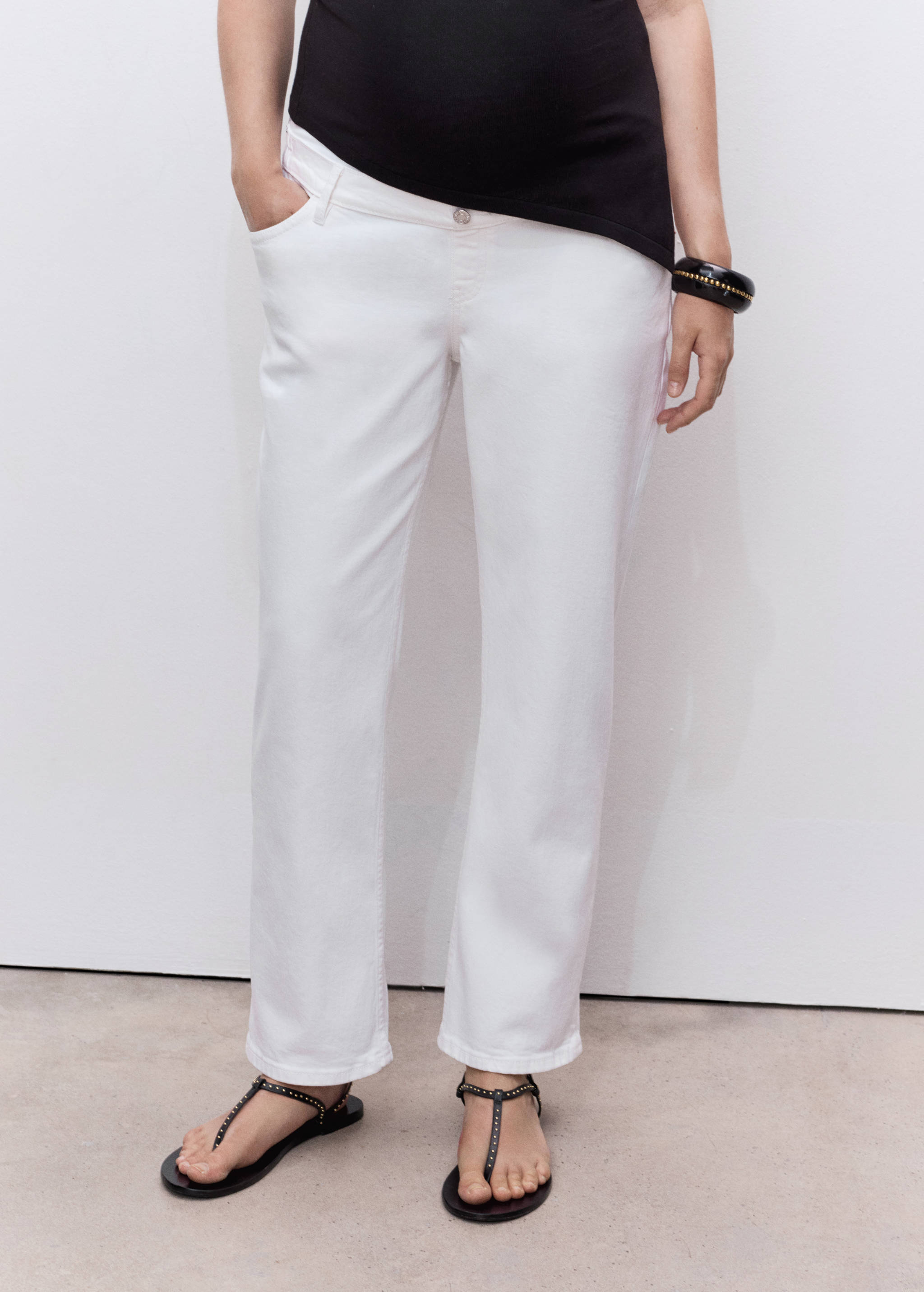 White straight-fit denim trousers with a low waist.