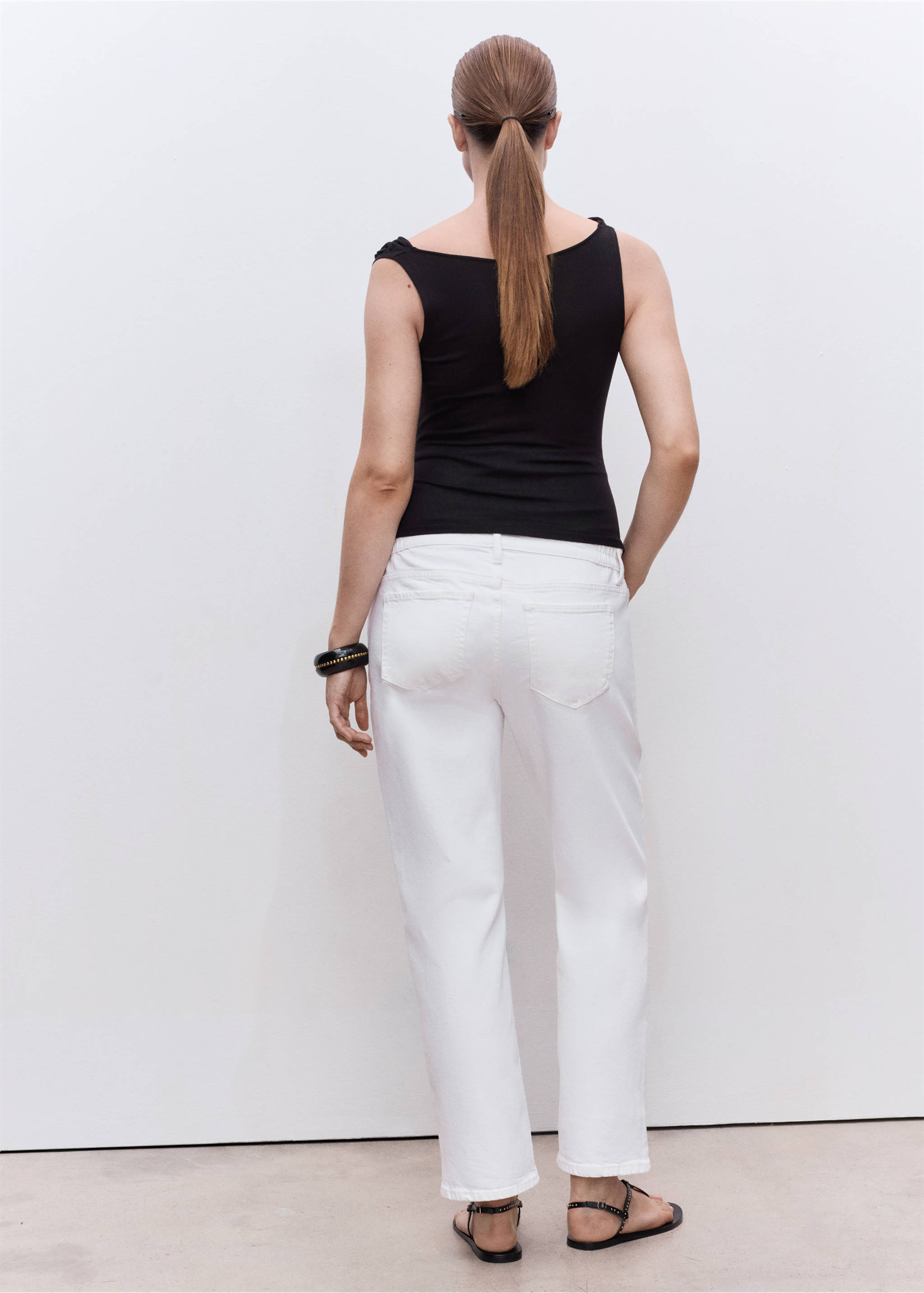 Back view of white denim trousers paired with a black top., White. Ref: 17001242-00.