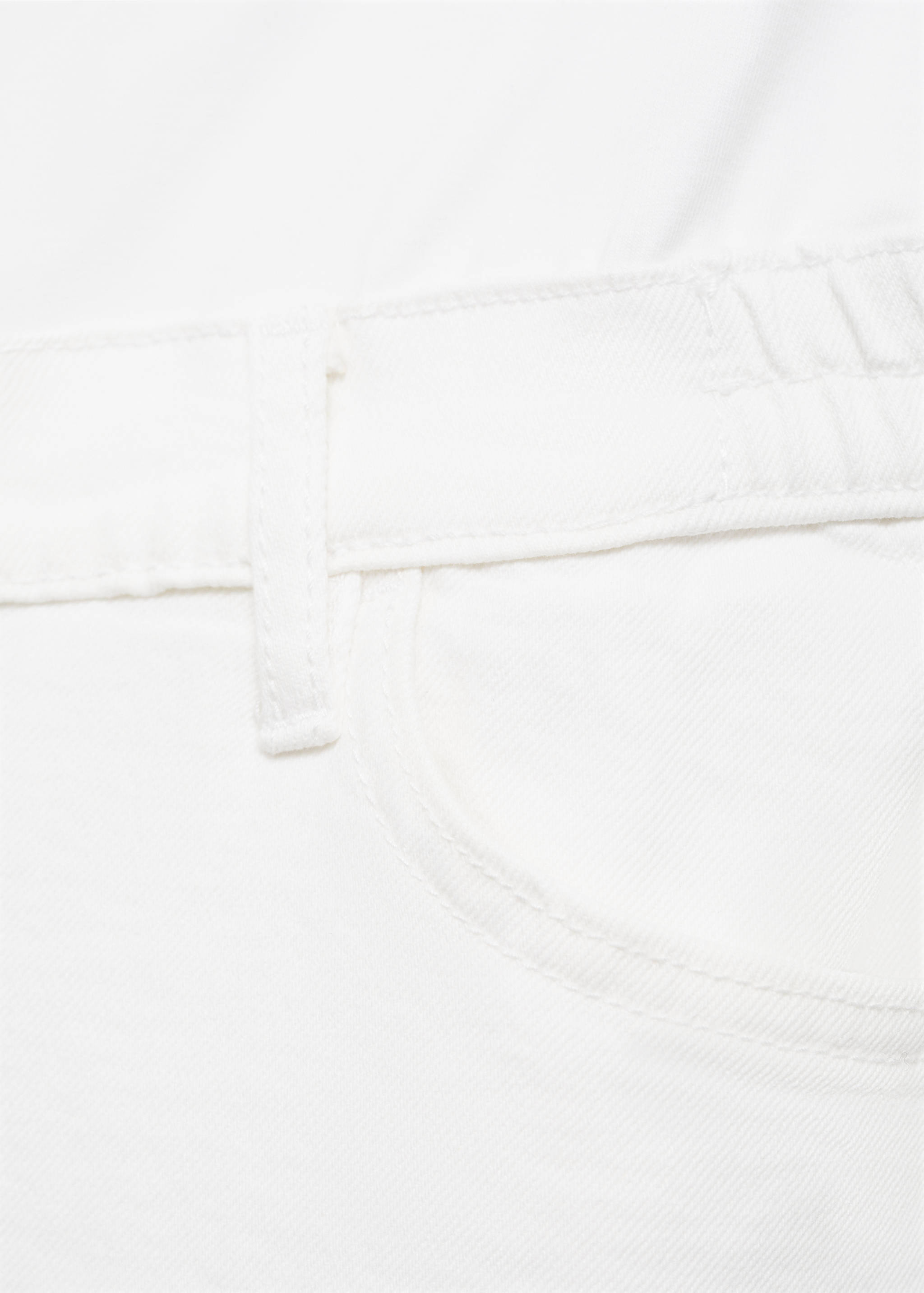 White denim trousers close-up of waistband and pocket