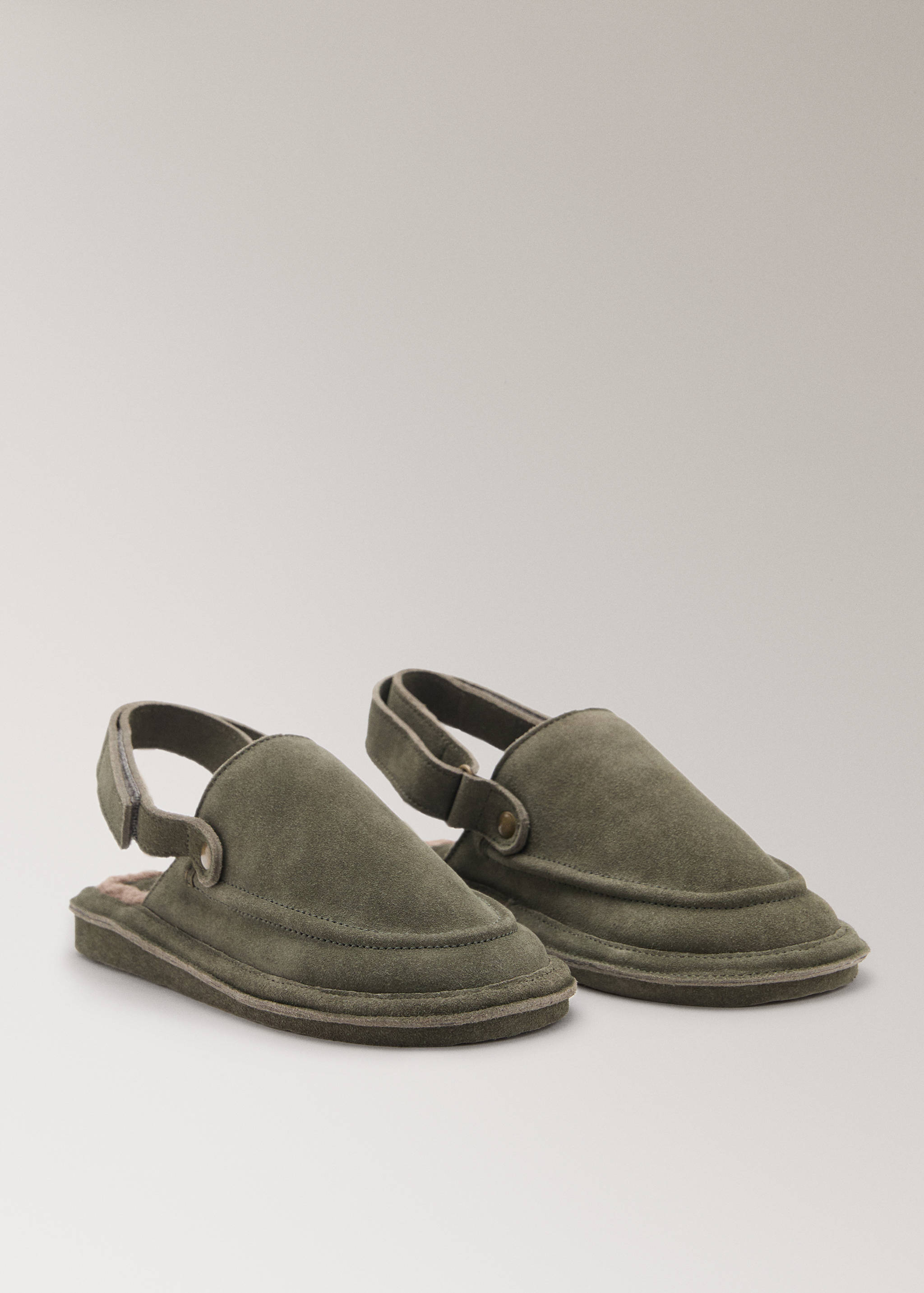 Khaki green suede house slippers with heel straps and plush faux-fur lining.