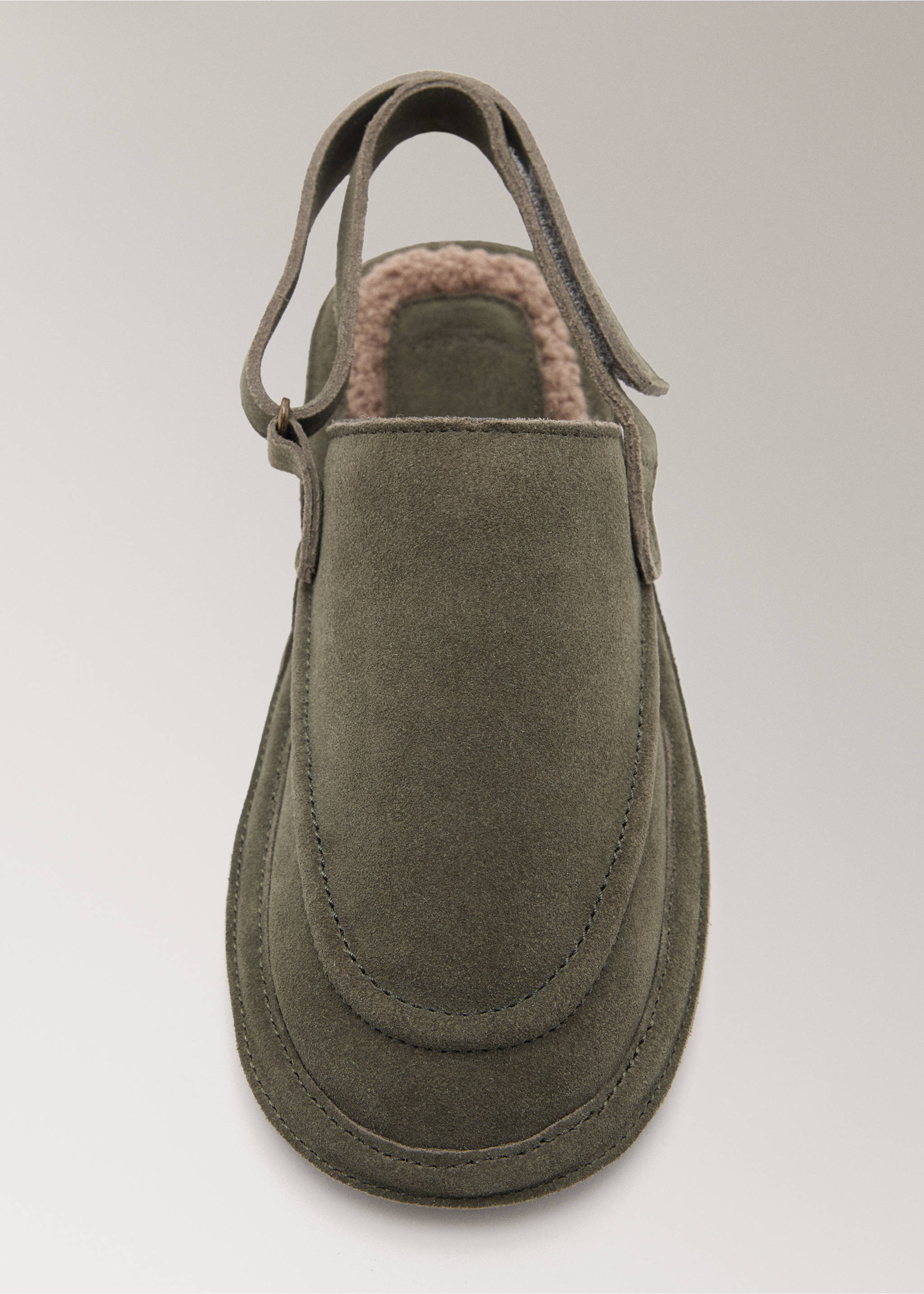 Olive green slippers with a slingback strap and soft lining, shown in close-up., Pastel Green. Ref: 17004110-00.