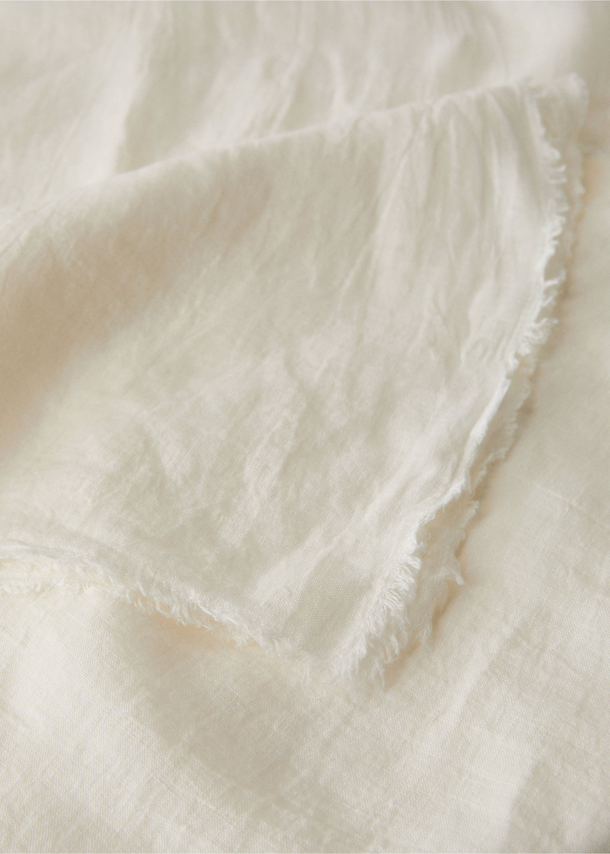 Off-white tablecloth detail with raw frayed edges., Off White. Ref: 17004150-00.
