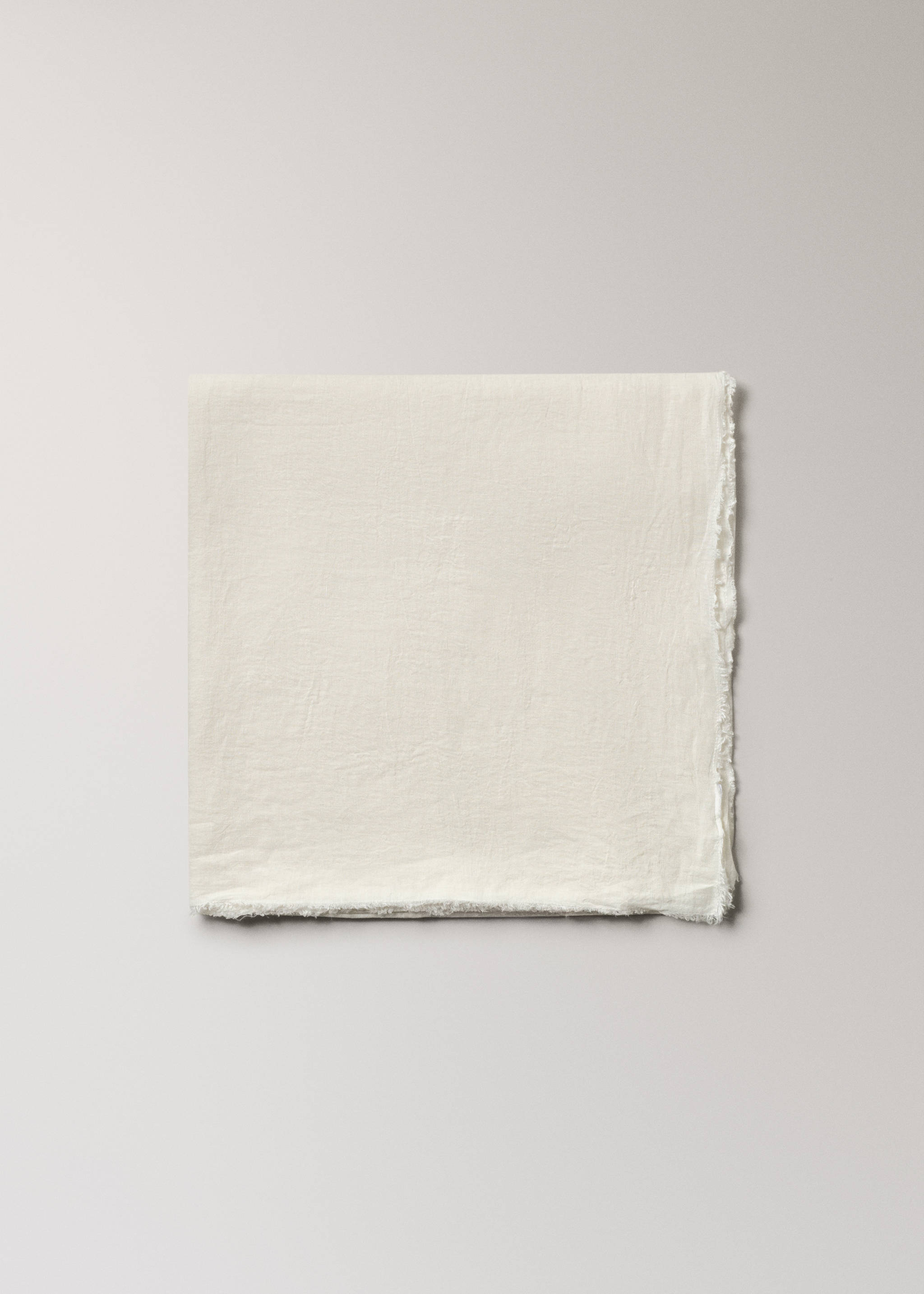 Off-white textile with frayed edges.