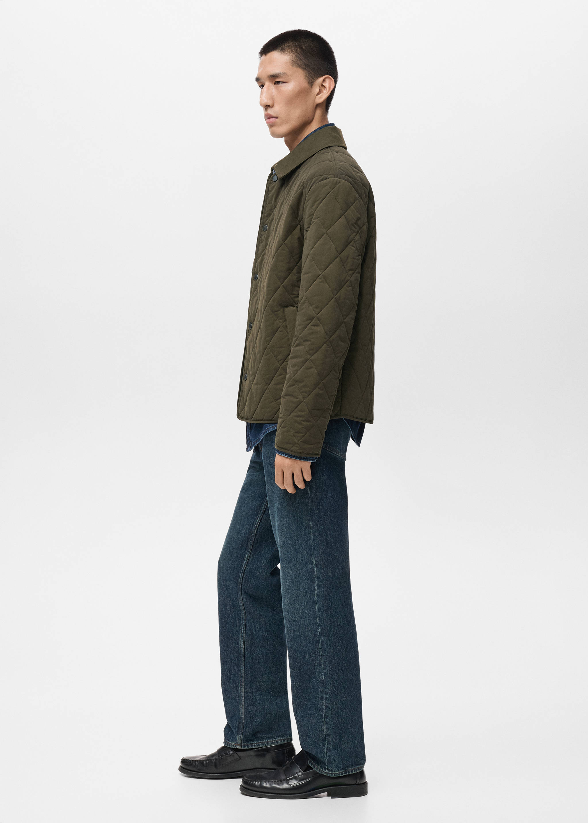 Olive green quilted jacket with a classic collar and button fastening.