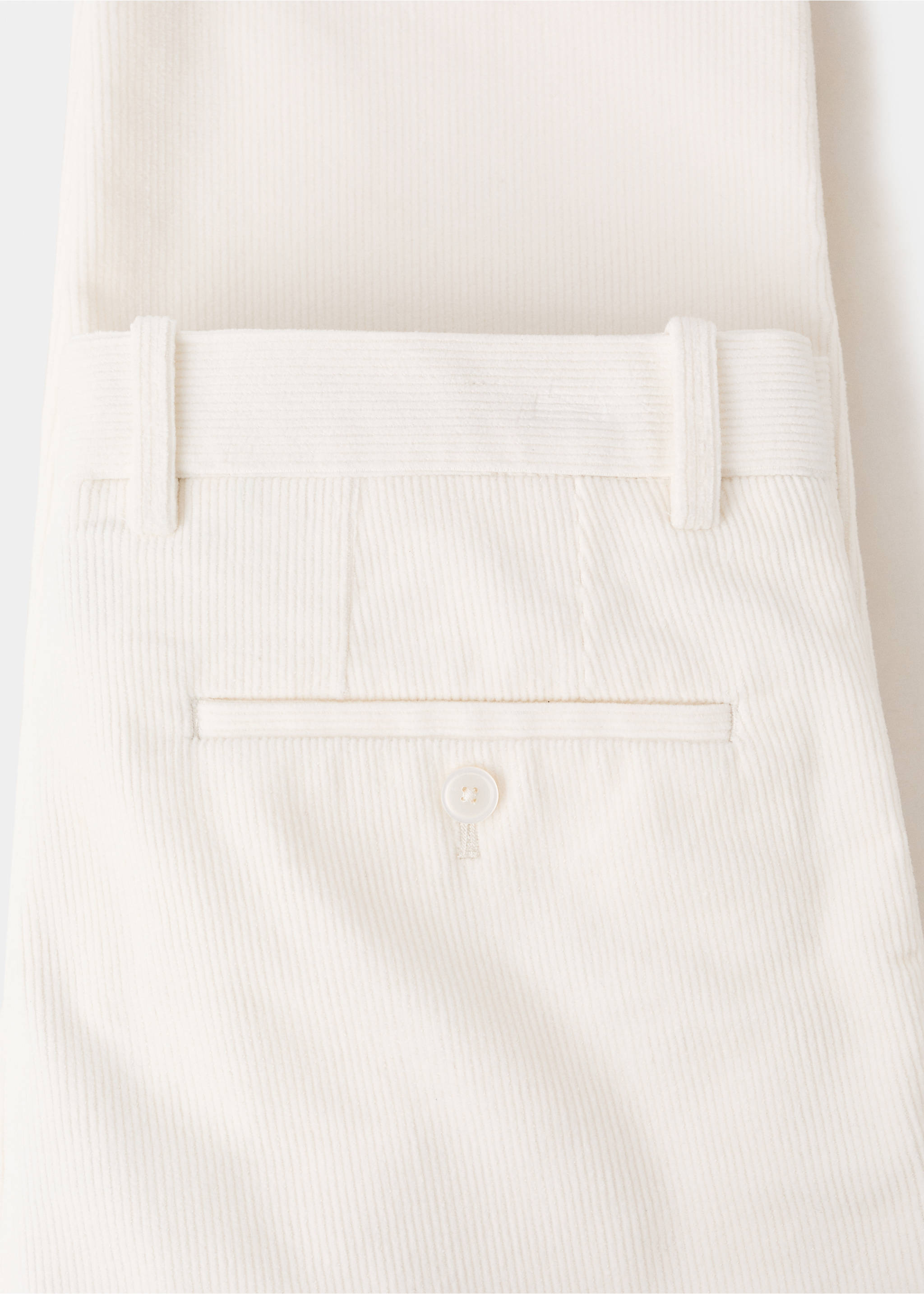 Close-up of off-white corduroy trousers showing the back pocket detail., Off White. Ref: 17007891-00.