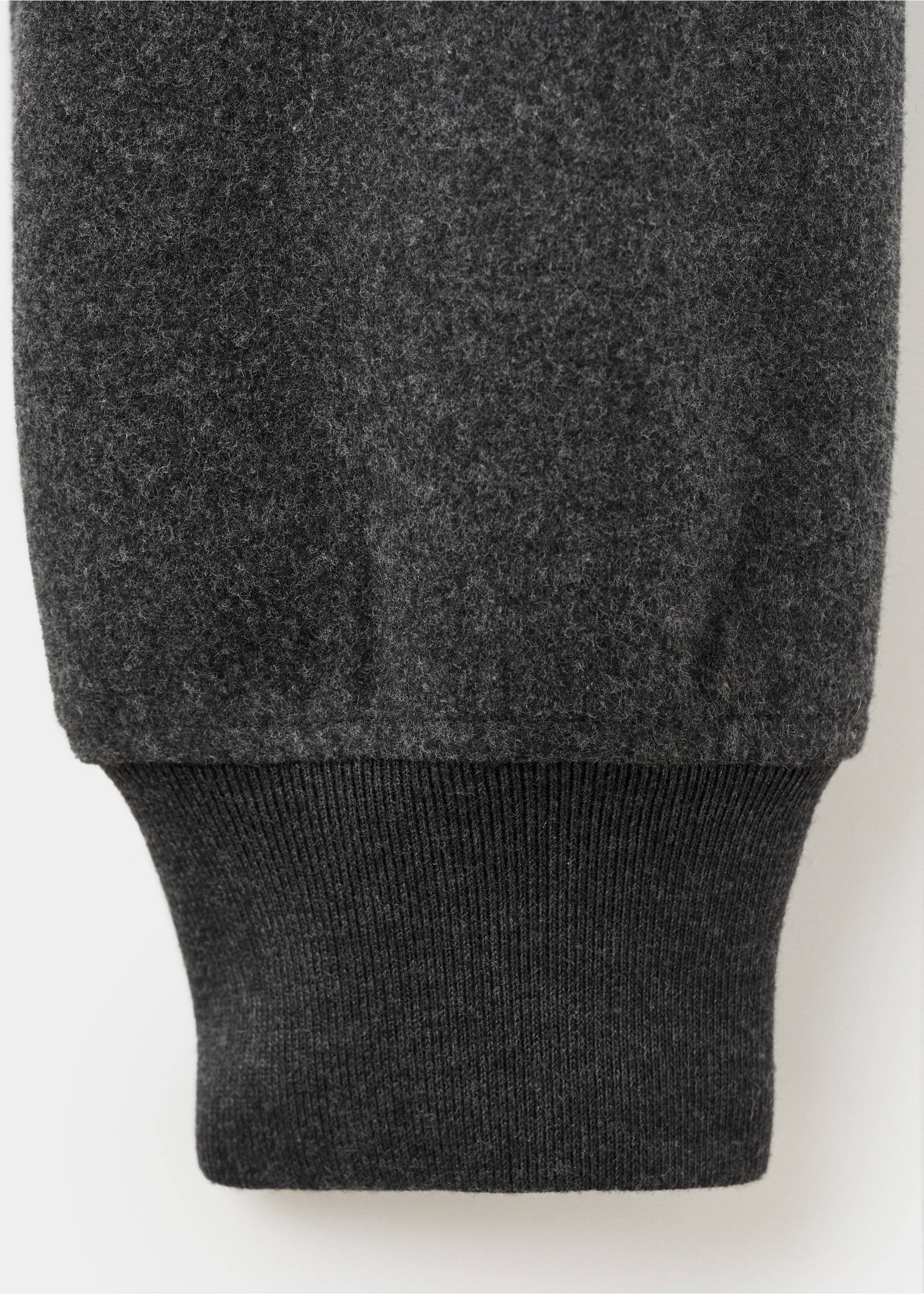 Close-up of the dark grey sweatshirt fabric and ribbed cuff., Dark Heather Grey. Ref: 17007903-00.