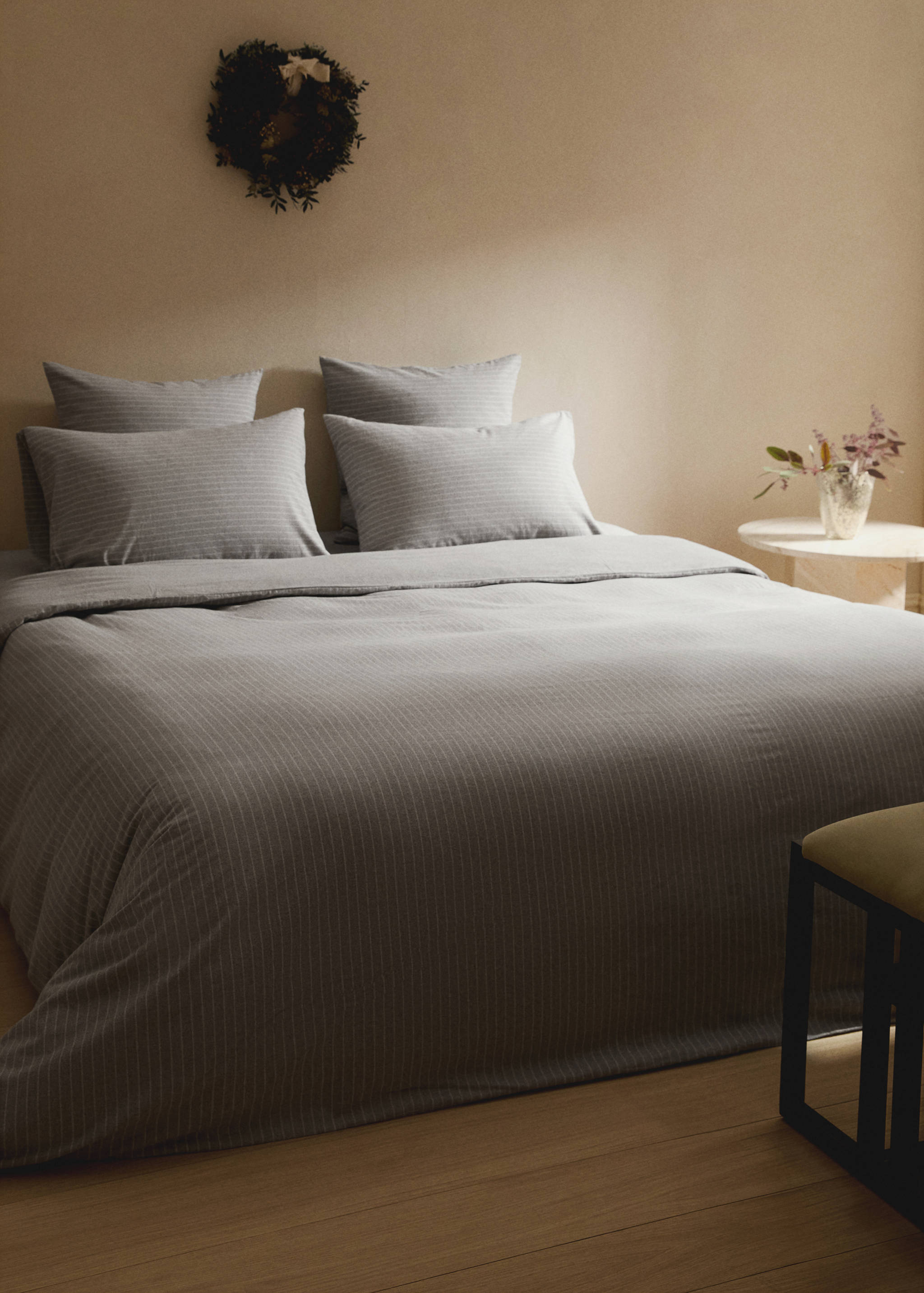 Grey pinstripe duvet cover with matching pillows on a made bed., Grey. Ref: 17008284-00.
