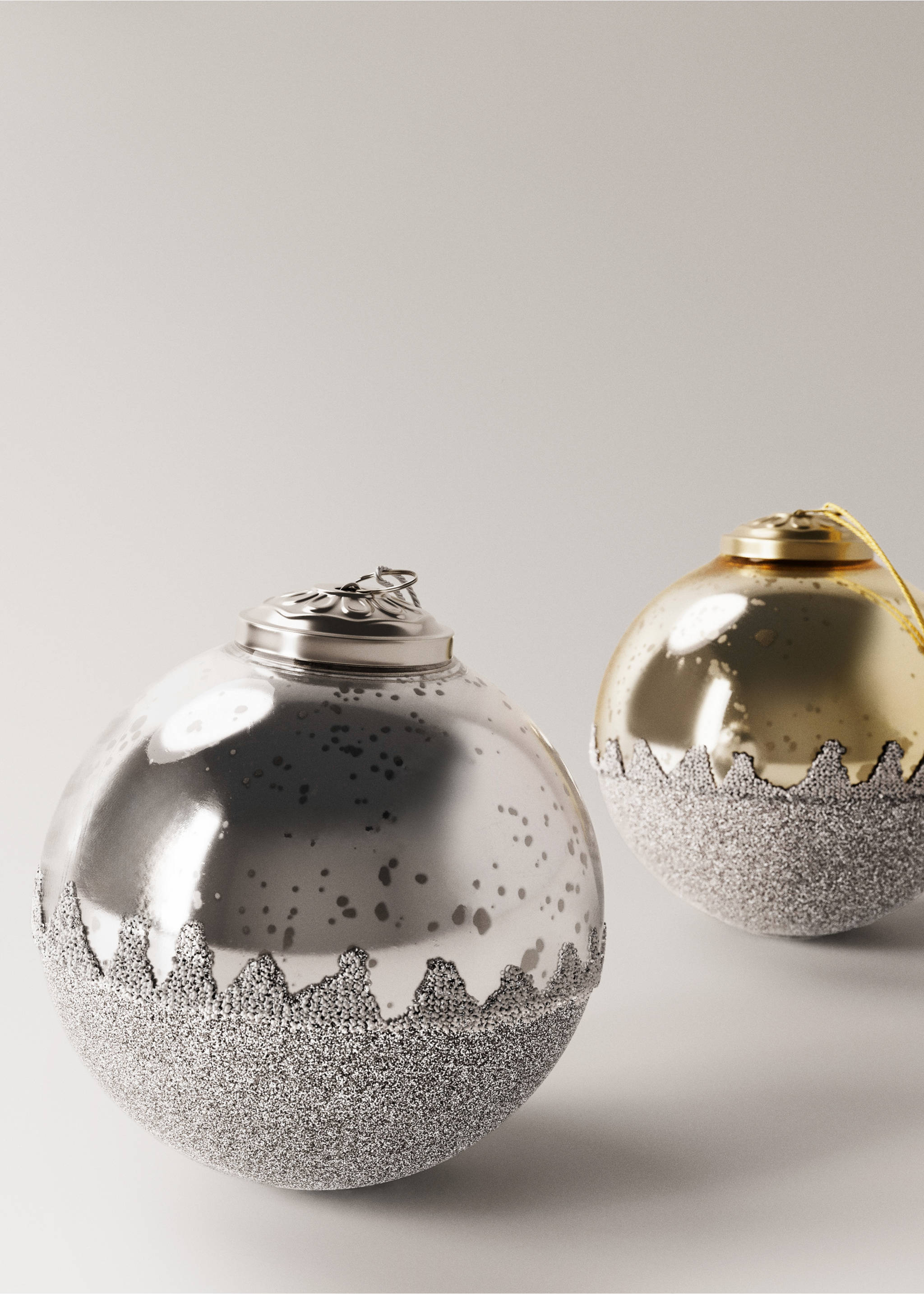 Silver and gold Christmas ornaments with textured glitter bases., Silver. Ref: 17008639-00.