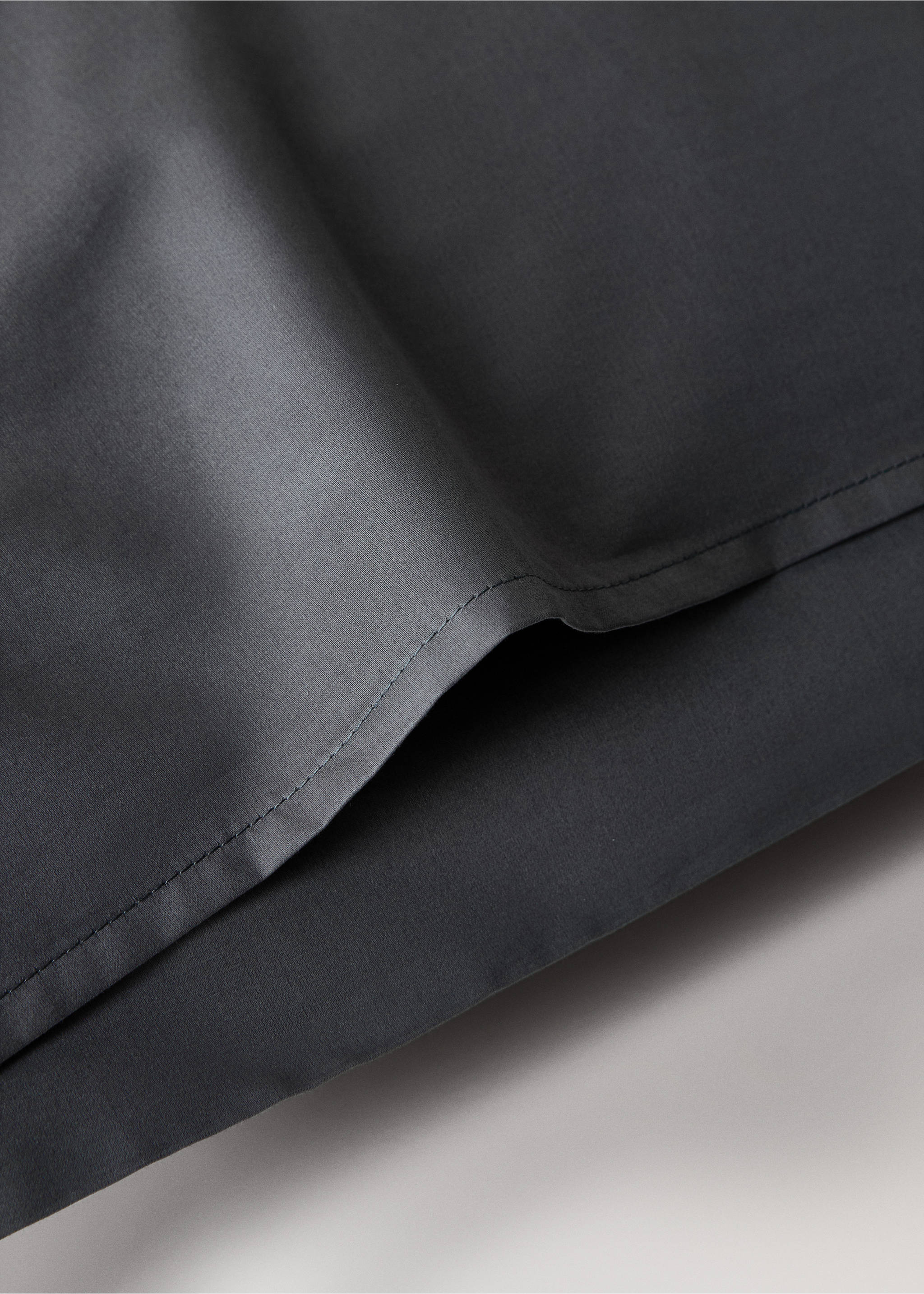 Dark grey pillowcase detail with stitched seam., Dark Grey. Ref: 17011583-00.