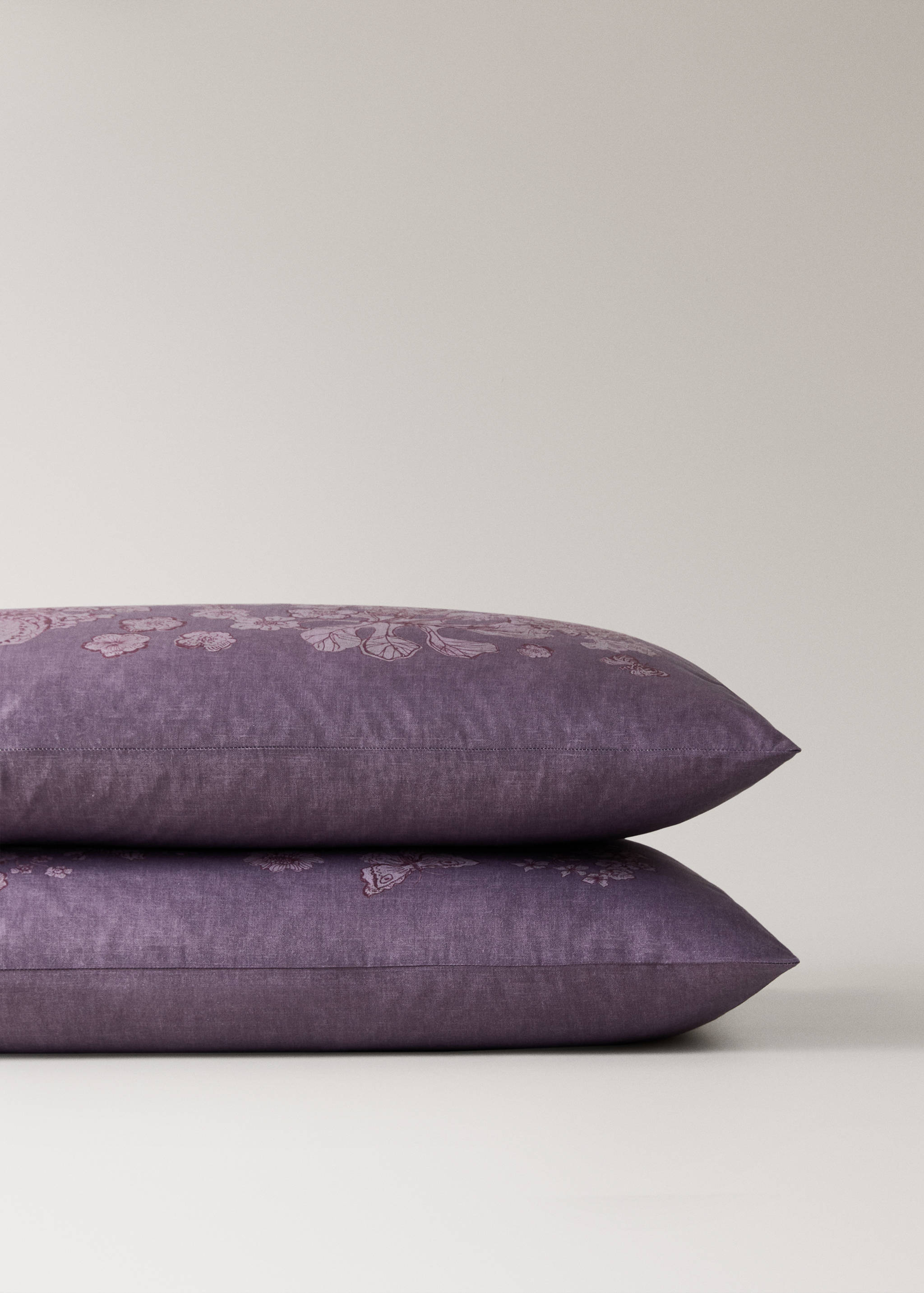 Purple pillowcase with tonal floral embroidery, shown in a stacked product view.