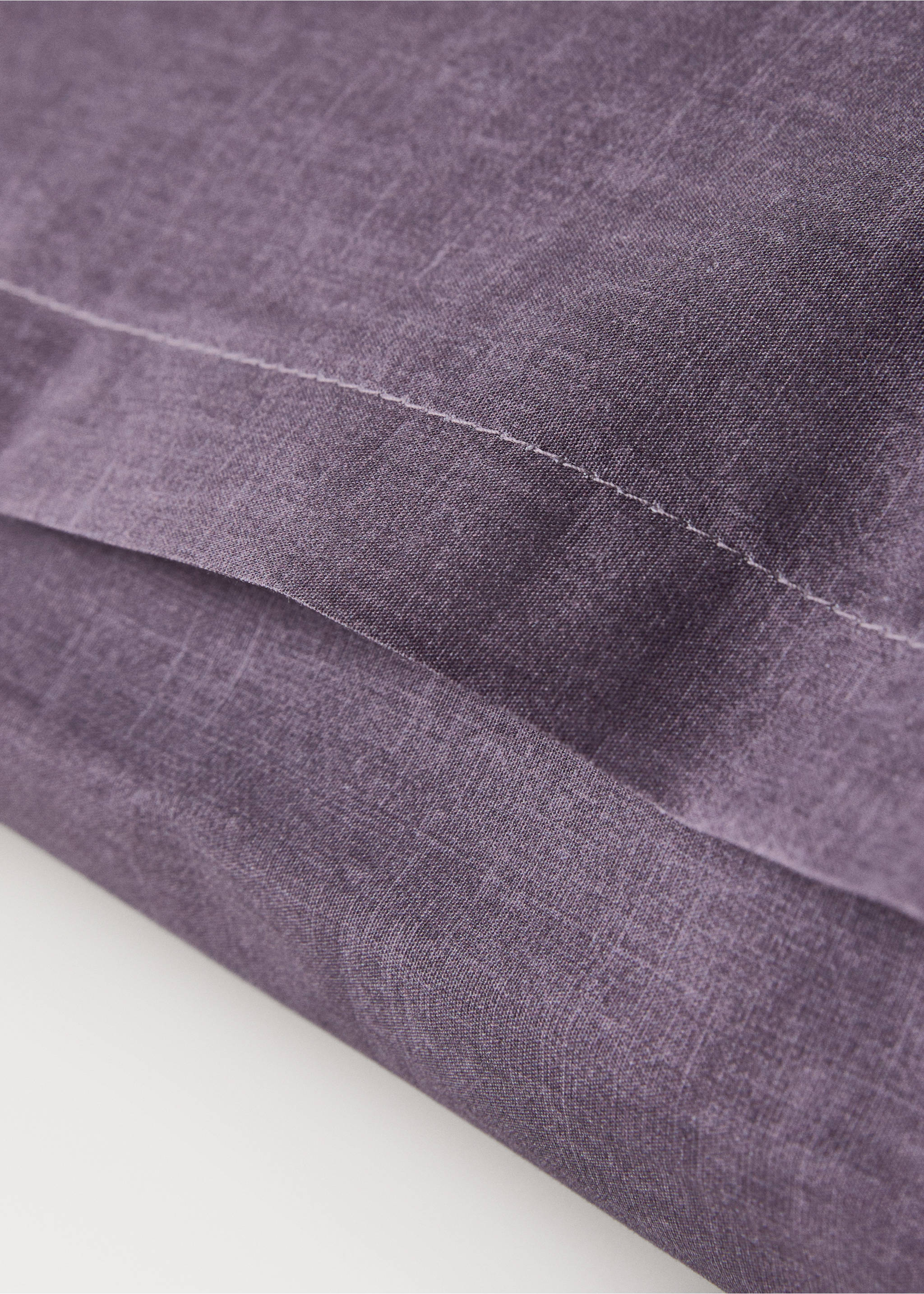 Purple pillowcase detail showing textured fabric and stitching., Plum. Ref: 17011609-00.