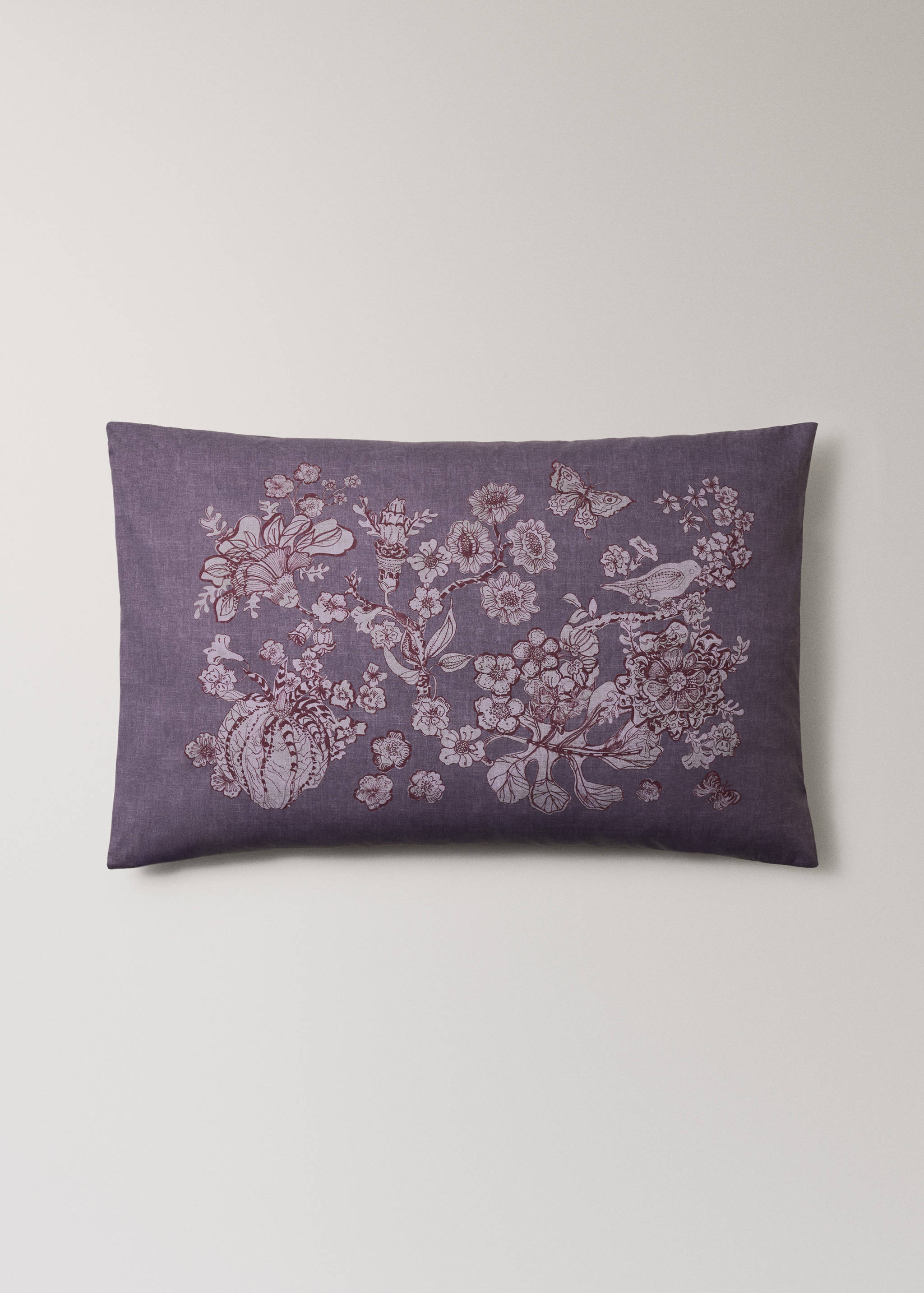 Purple pillowcase with an intricate plum-coloured botanical print.