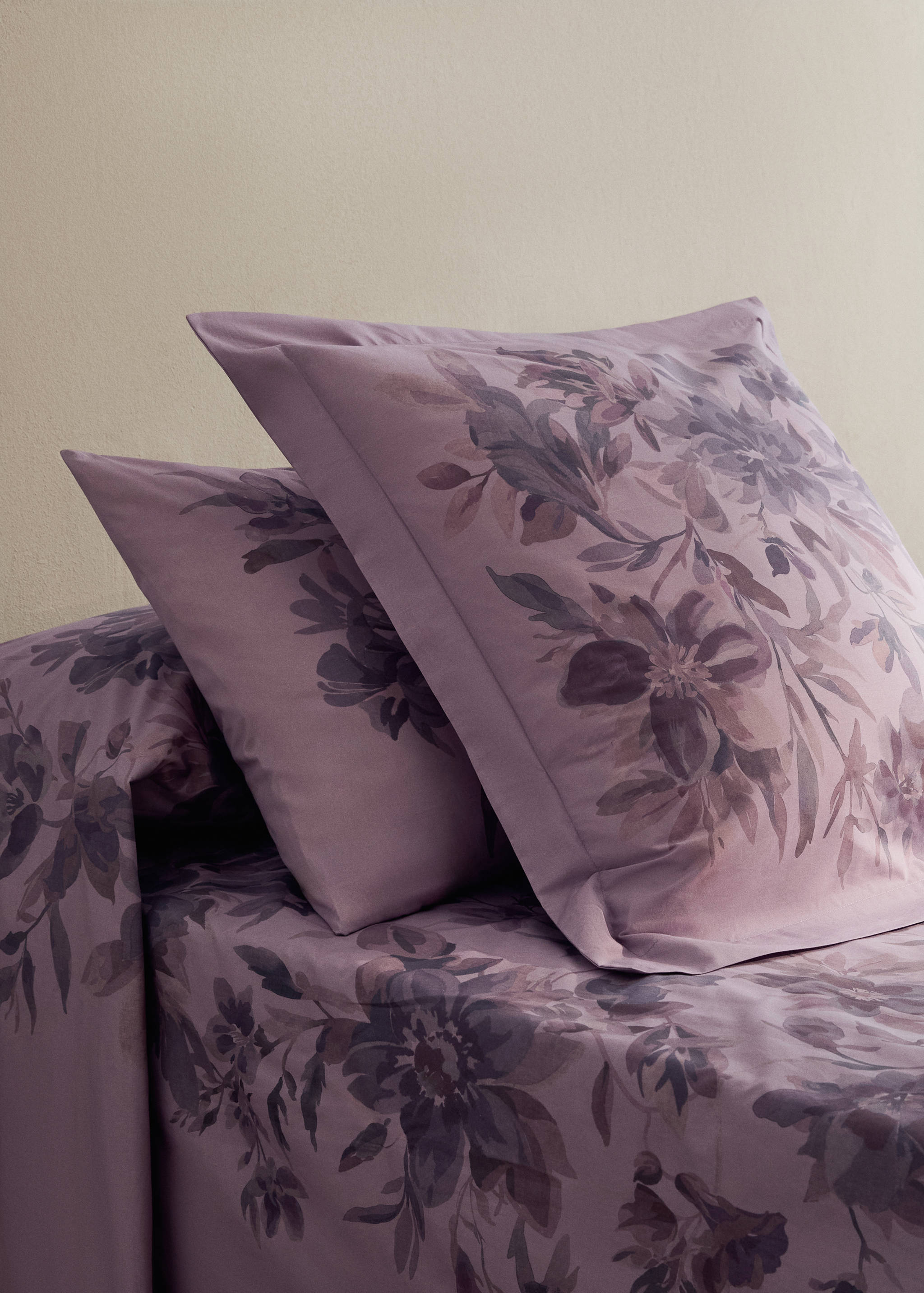 Purple floral-print pillowcase with a watercolour botanical design.