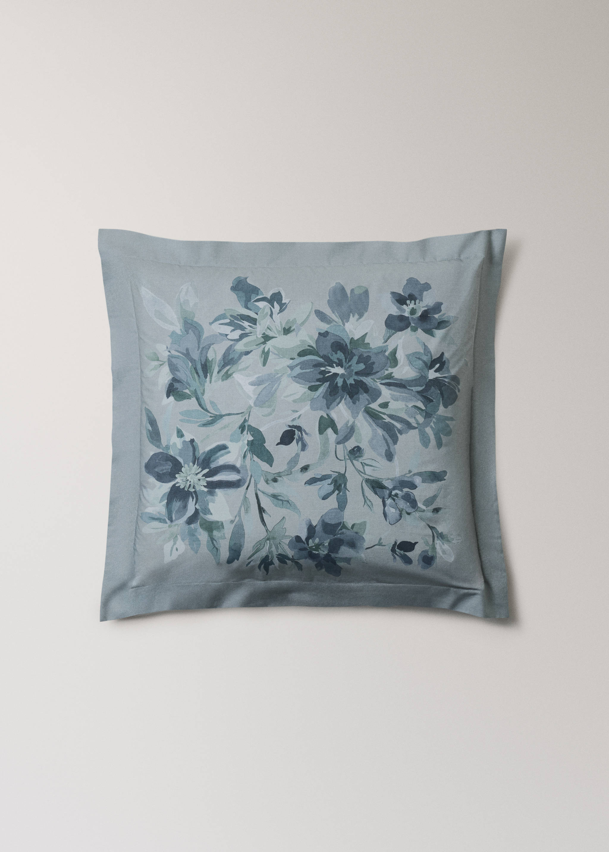 Light blue pillowcase with a floral pattern and bordered edge.