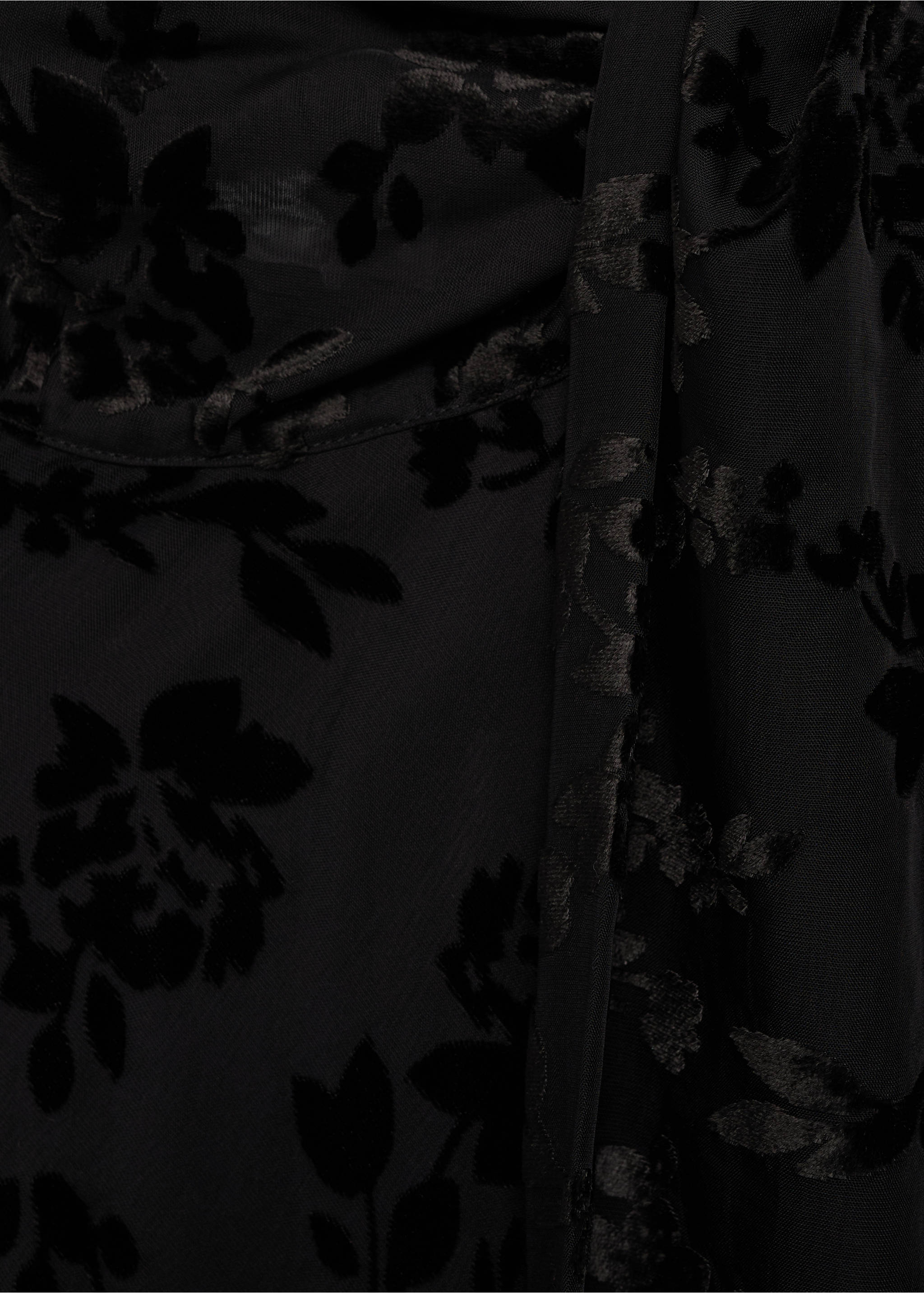 Close-up of black dress fabric featuring a velvety floral burnout pattern., Black. Ref: 17015826-00.
