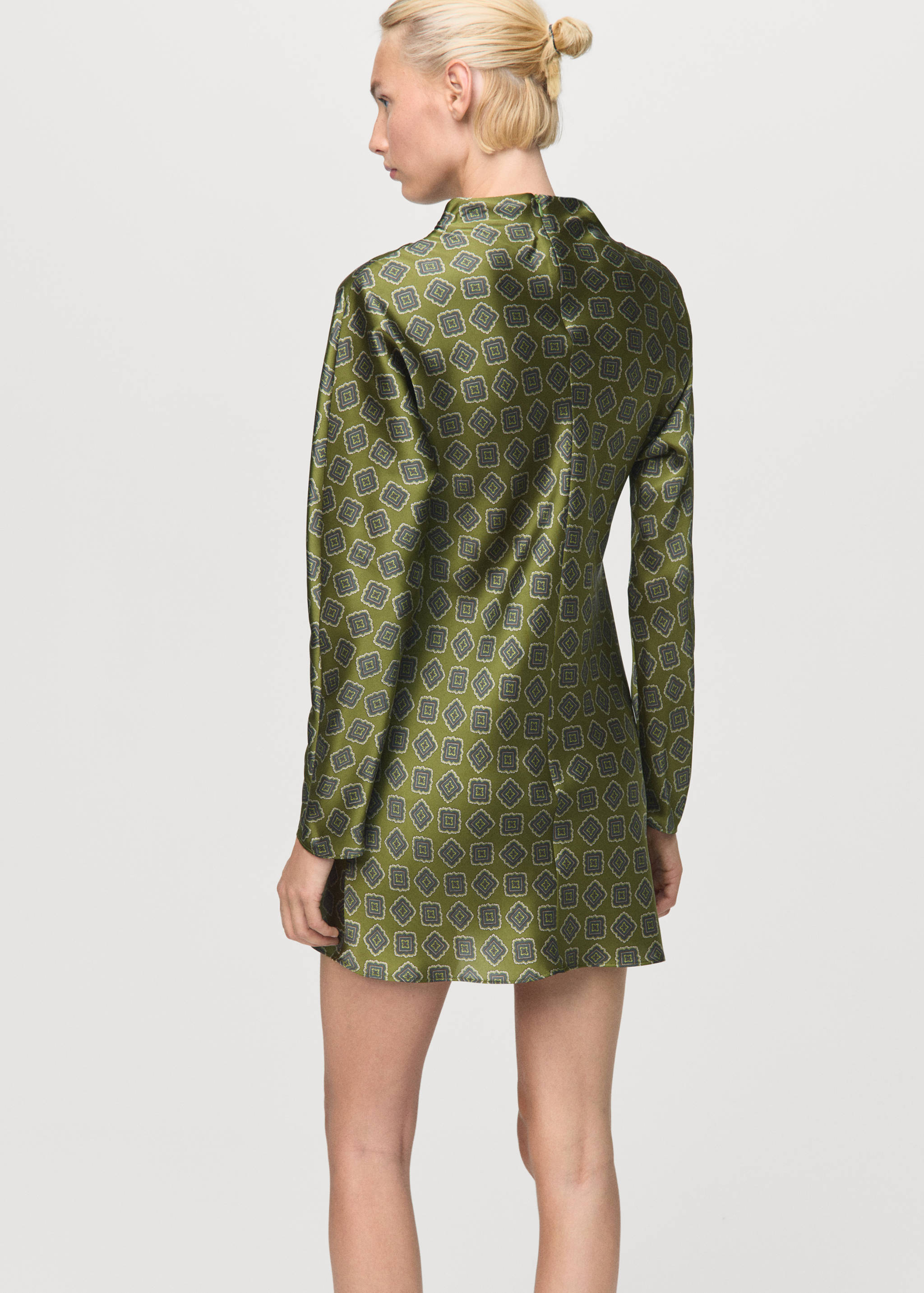 Green geometric print long-sleeved dress, back view.