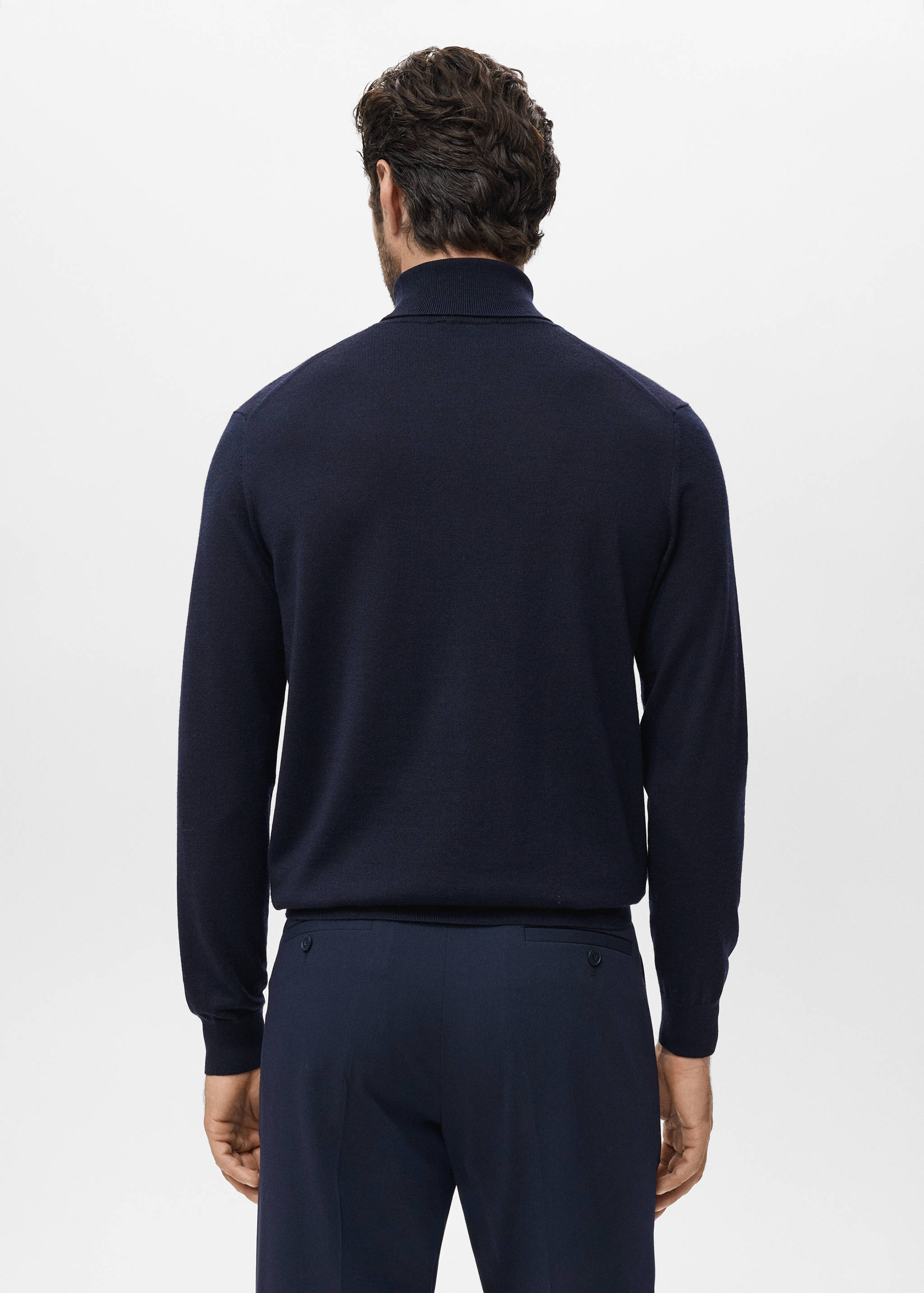 Navy blue turtleneck jersey, back view.
