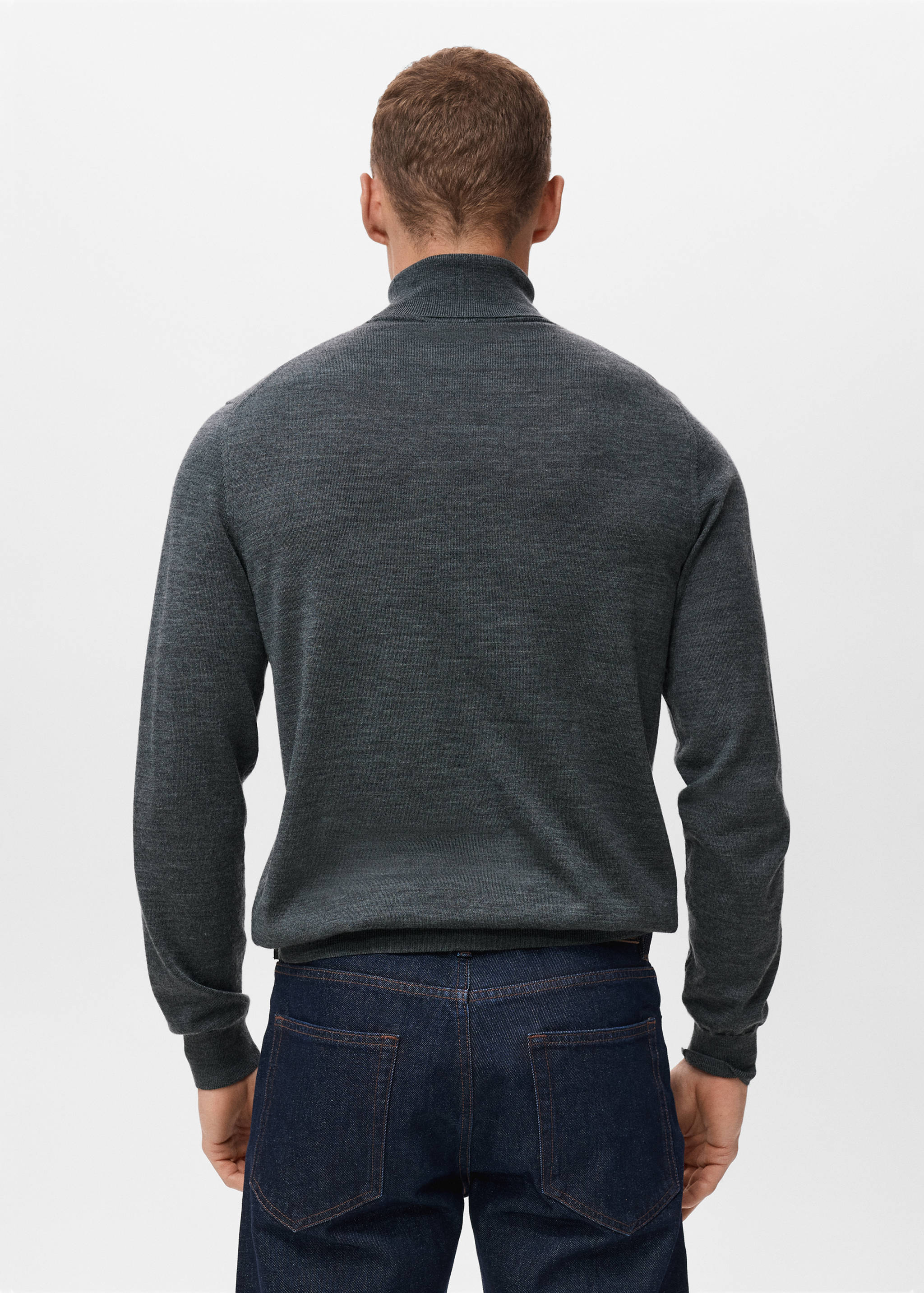 Dark grey knitted turtleneck jersey, back view.