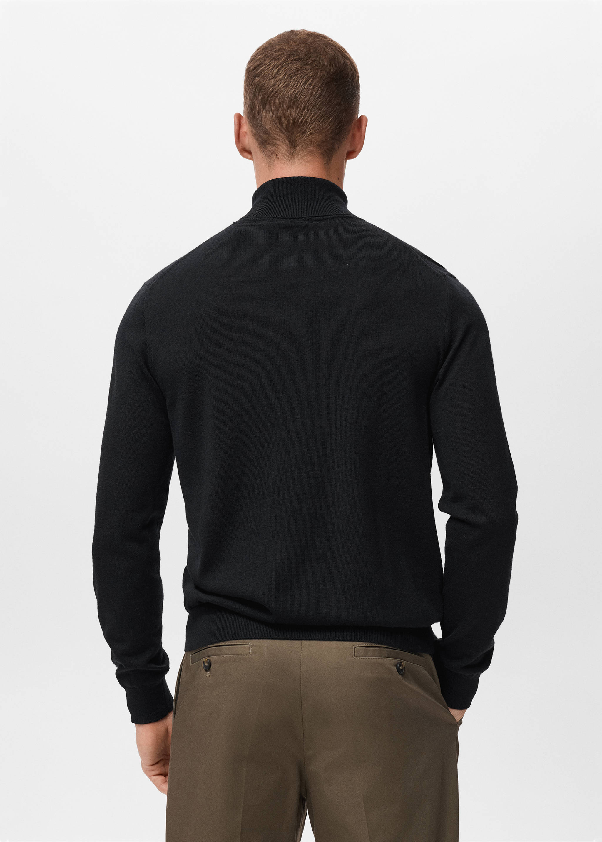 Black knit jersey with a high collar, shown from the back.