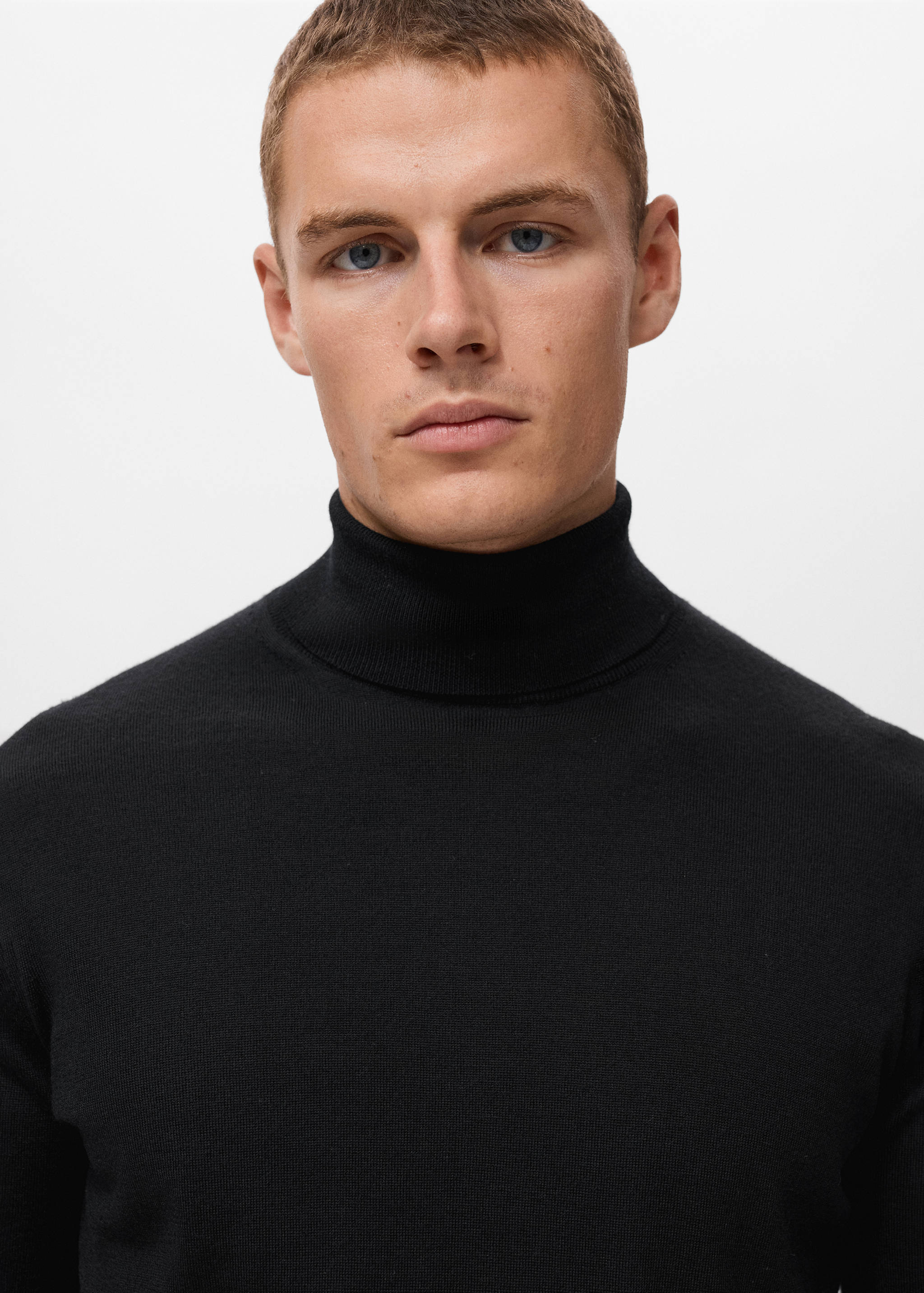 Black turtleneck jersey, close-up view on model