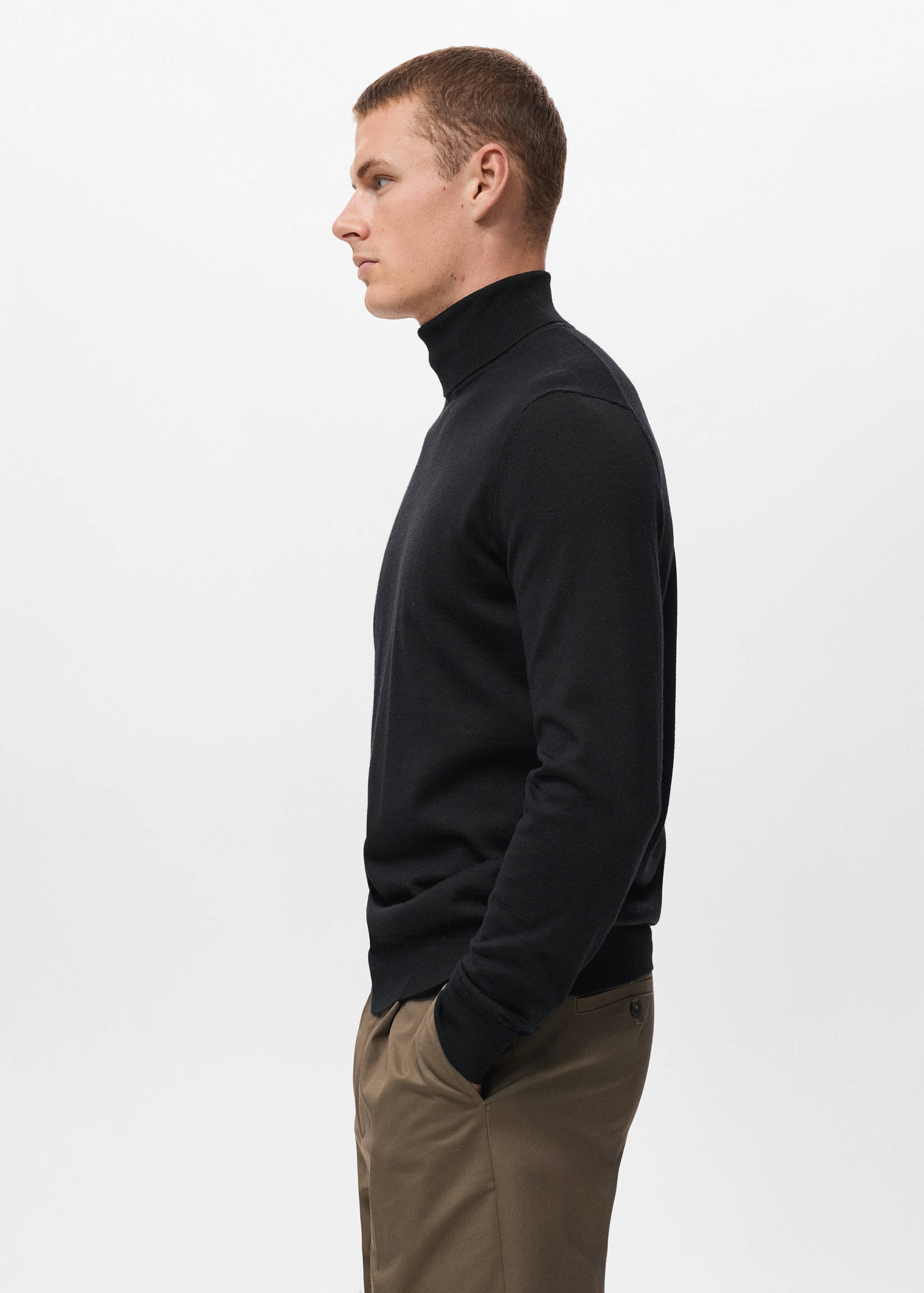 Black turtleneck jersey with long sleeves and ribbed trims.