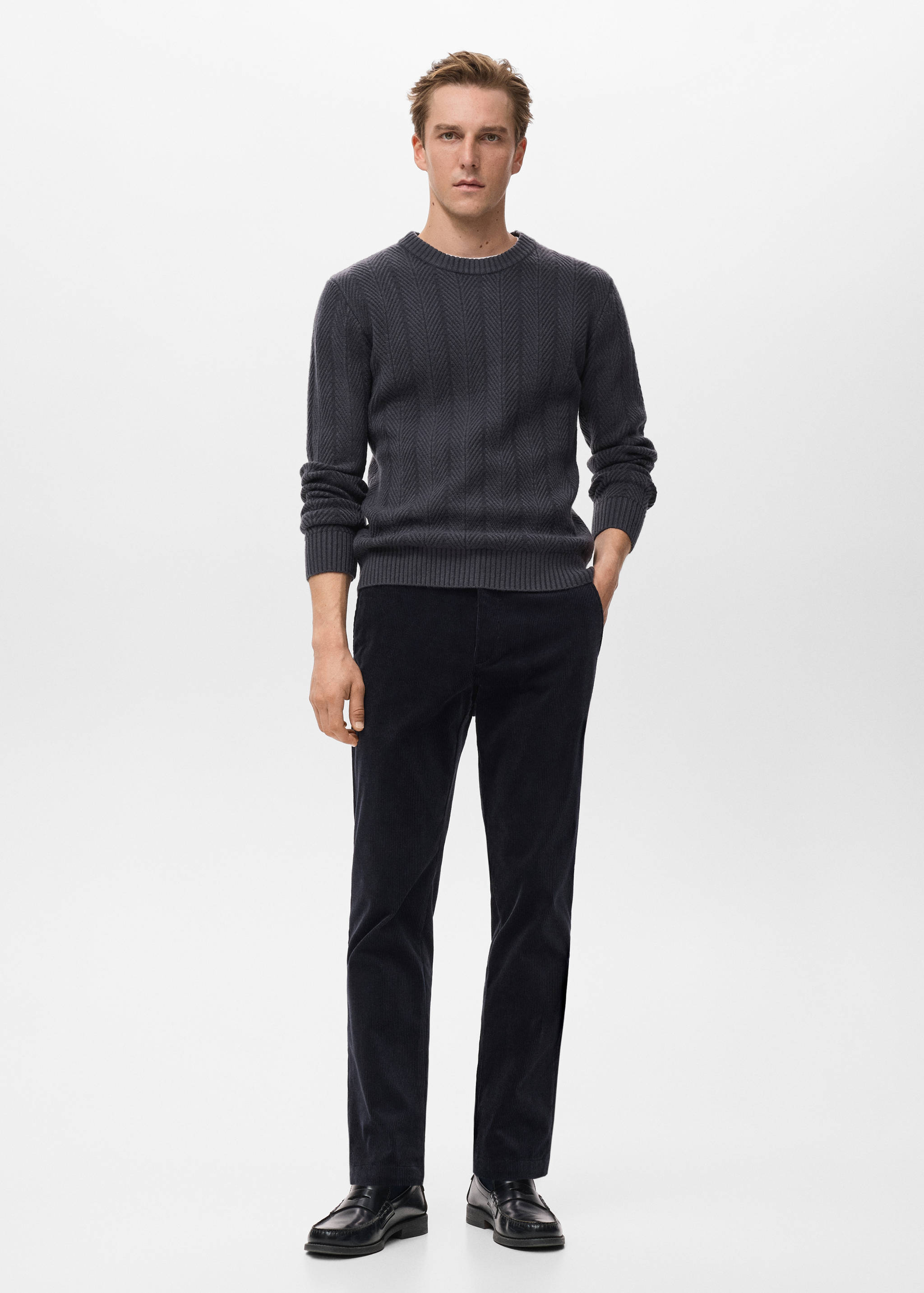 Dark grey knitted jersey with a ribbed crew neck and chevron texture.