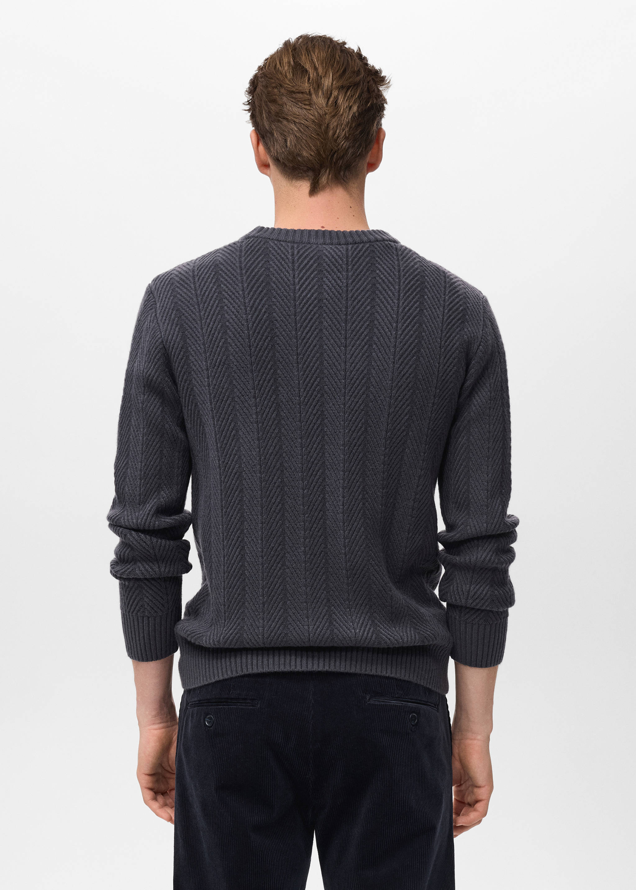 Back view of a dark grey textured knit jersey with a crew neck.