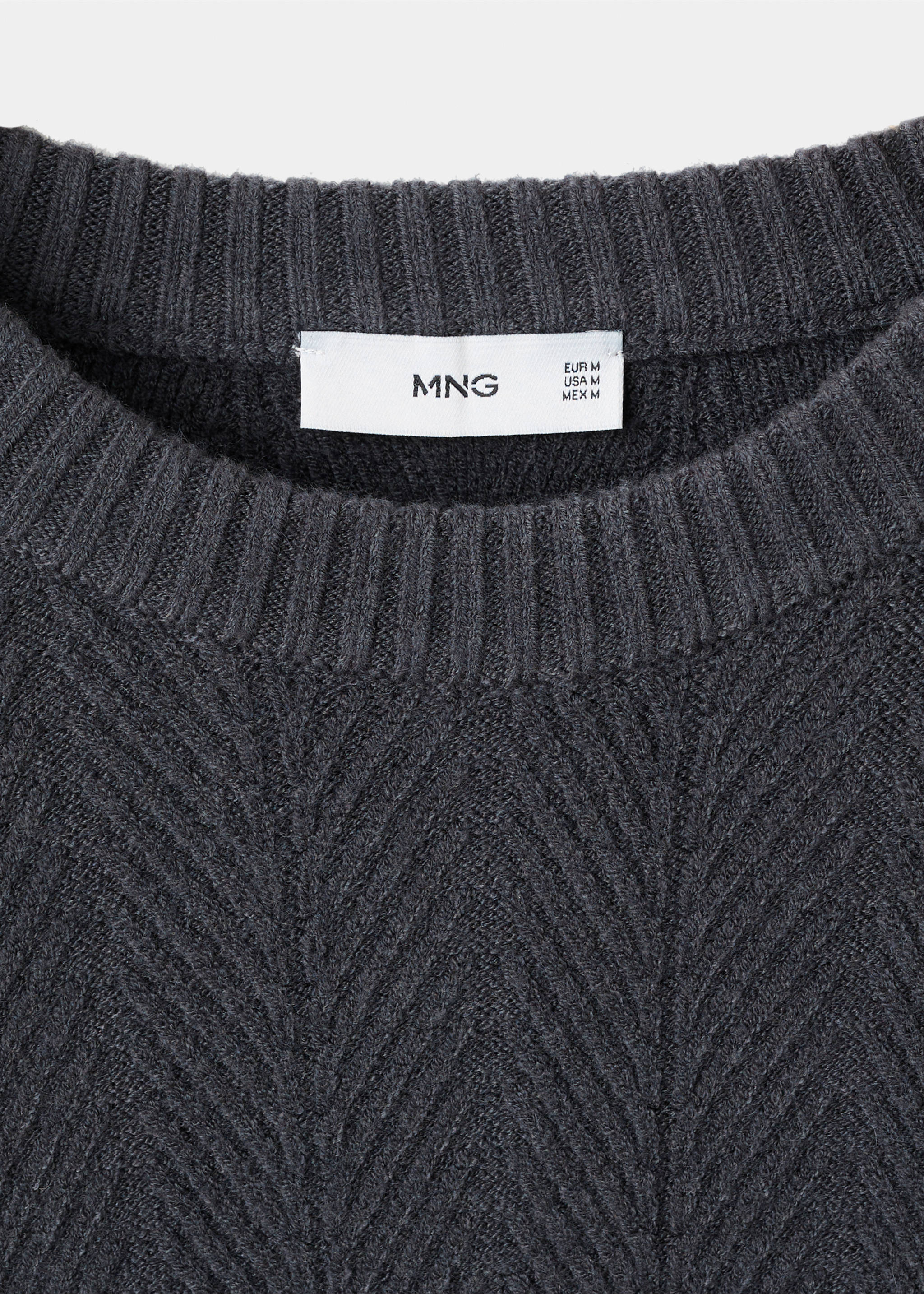 Close-up of a dark grey knit jumper's ribbed crew neckline and label., Indigo Blue. Ref: 17017904-00.