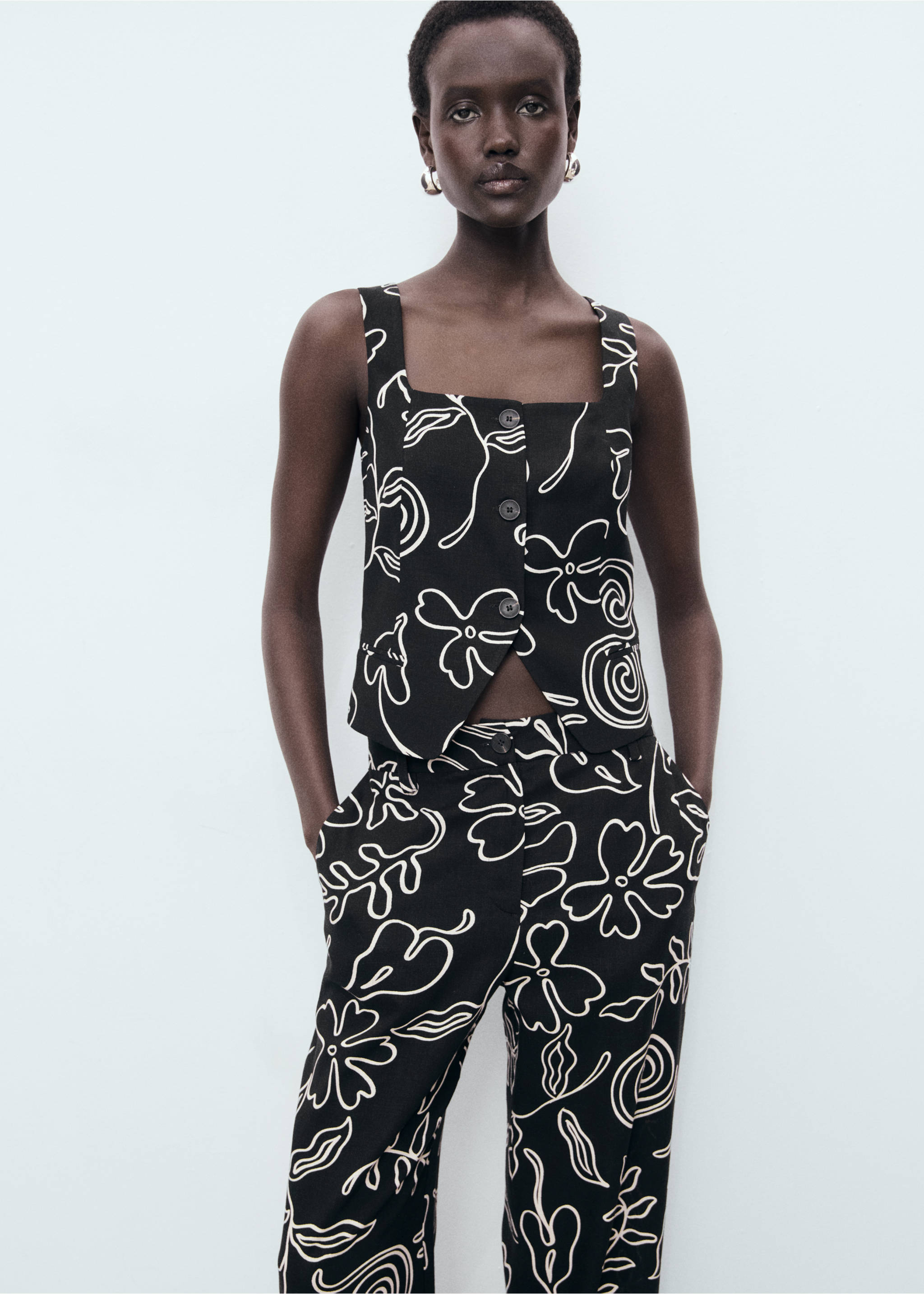 Floral-print linen-blend trousers - Details of the article 1, Black. Ref: 17021167-00.