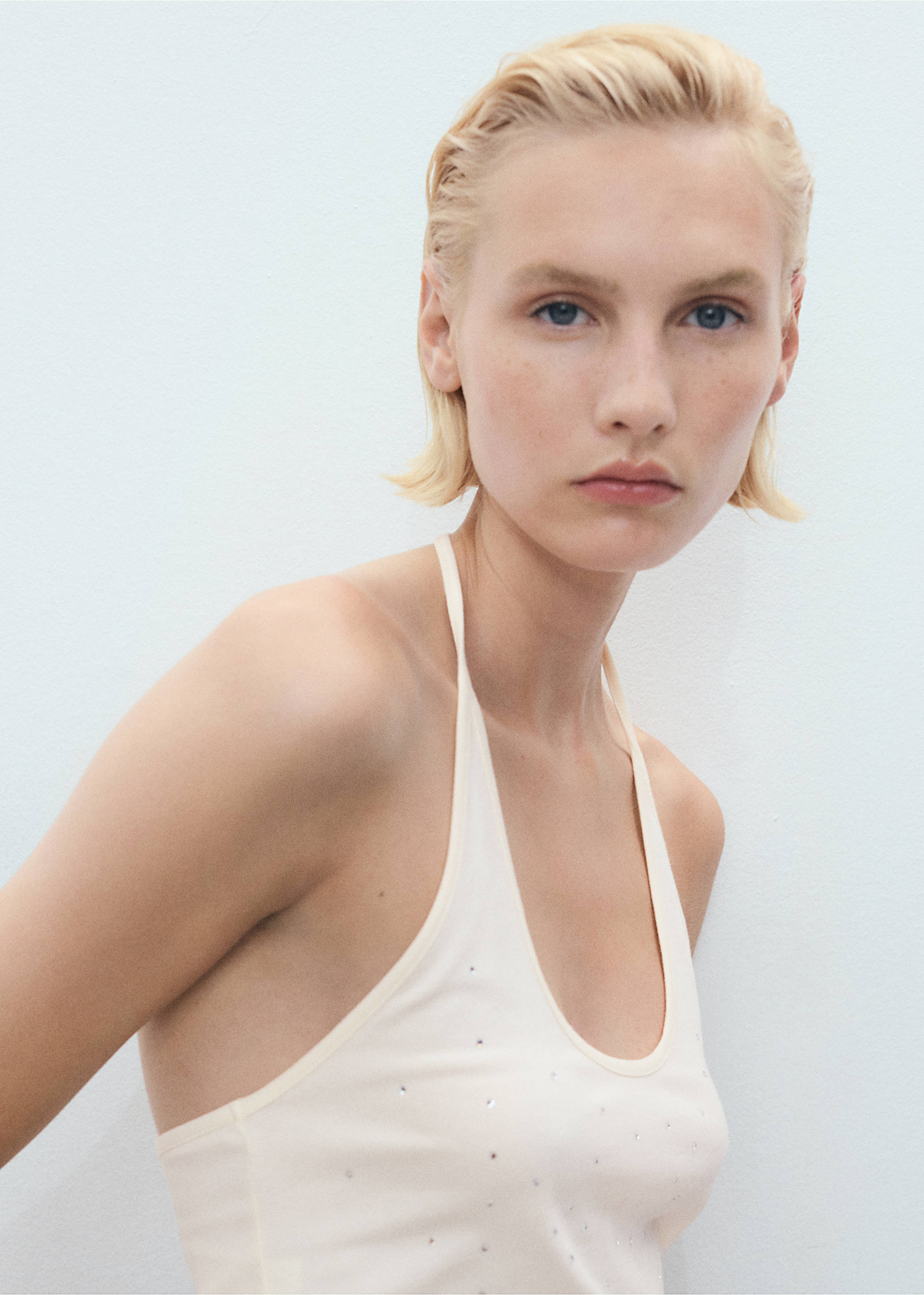 Halter neck top with metallic appliqués - Details of the article 1, Ecru. Ref: 17021220-00.