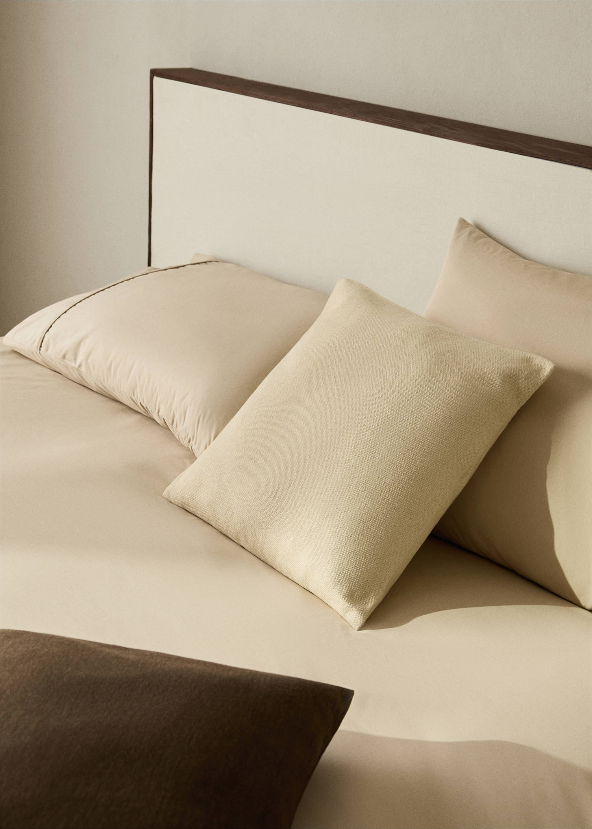 Beige duvet cover on a made bed with matching pillows and cushions., Beige. Ref: 17021548-00.