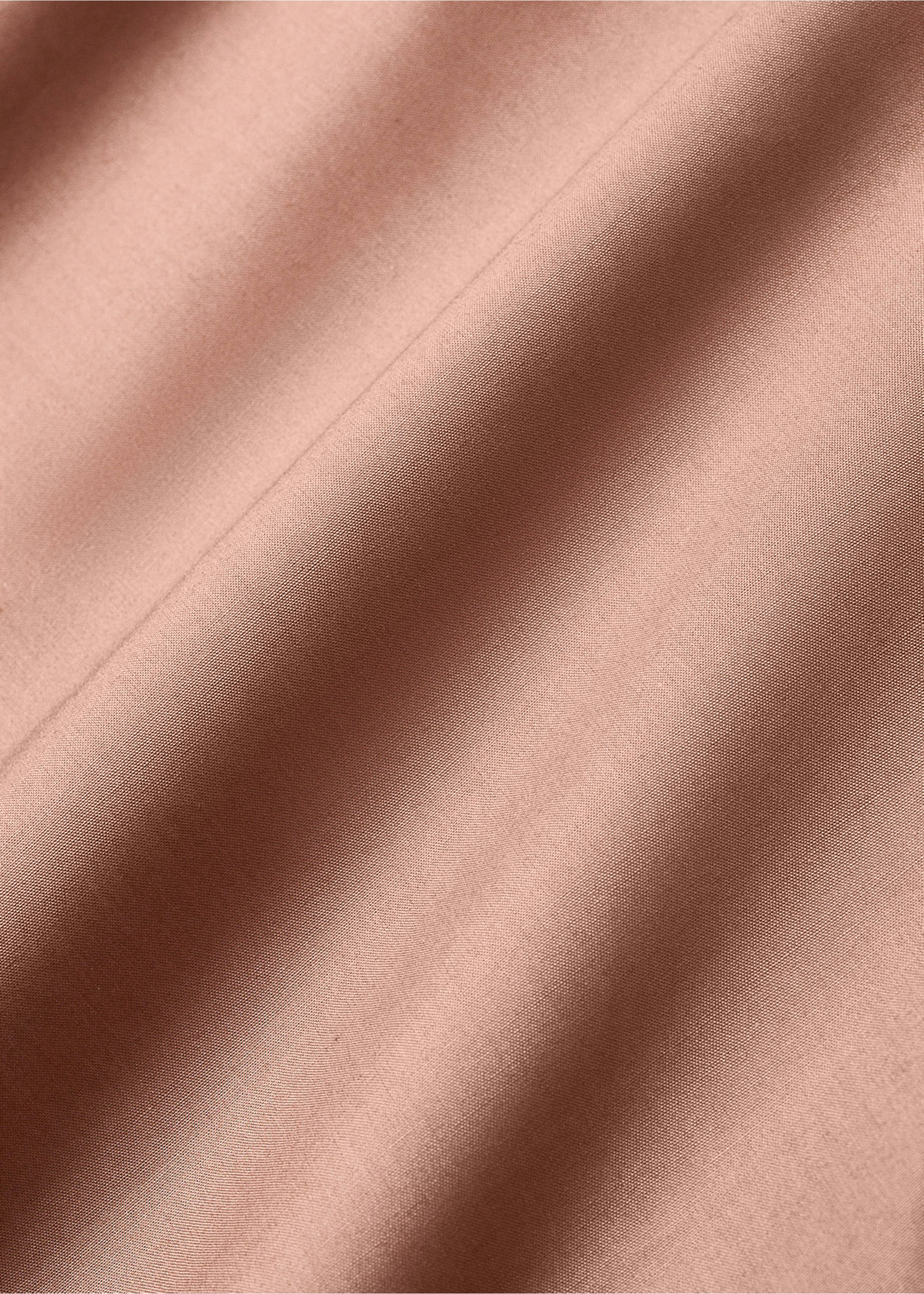 Close-up detail of a pink top sheet fabric showing soft folds., Brown. Ref: 17021586-00.