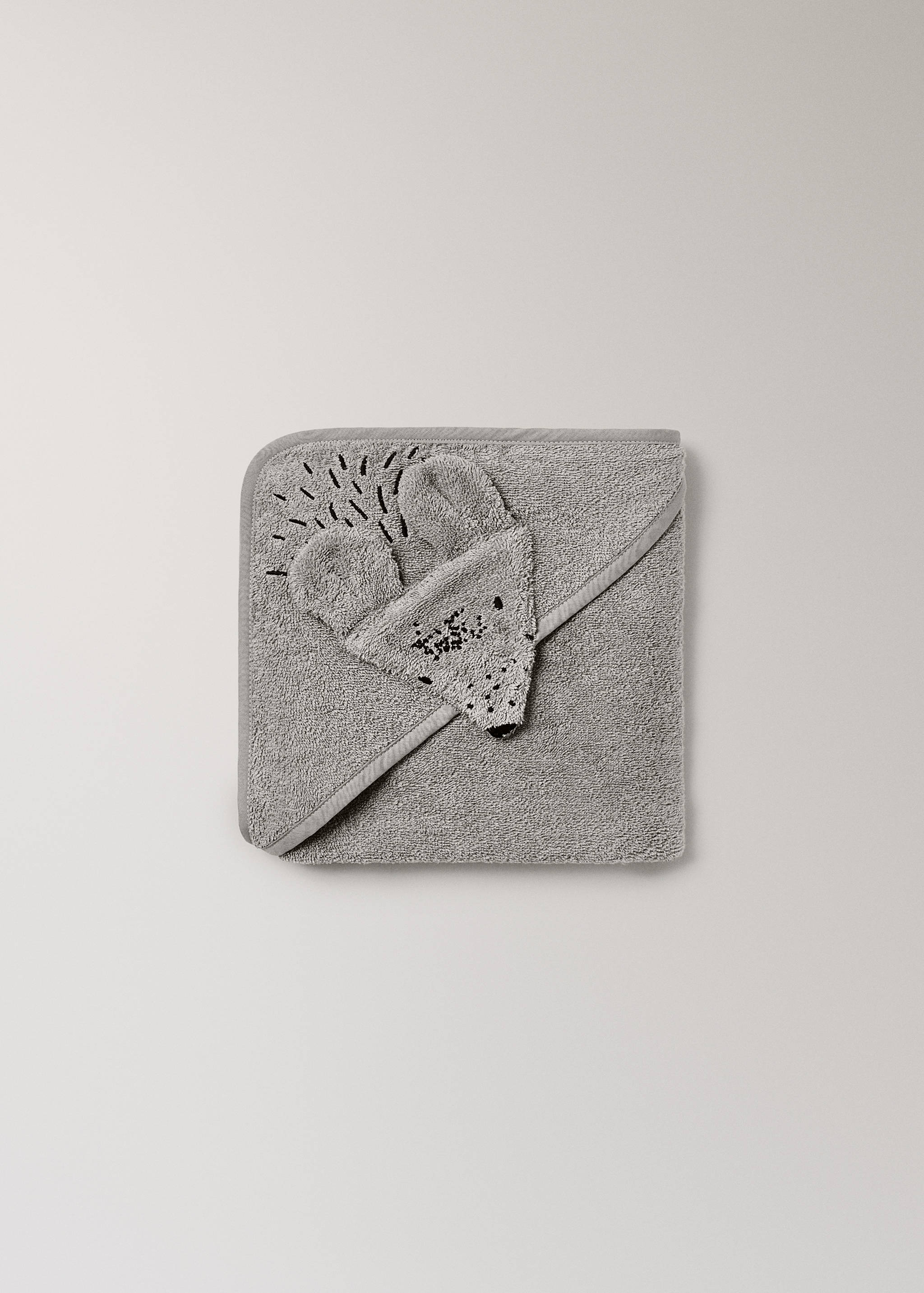 Grey terry hooded towel with a hedgehog appliqué and embroidered details.