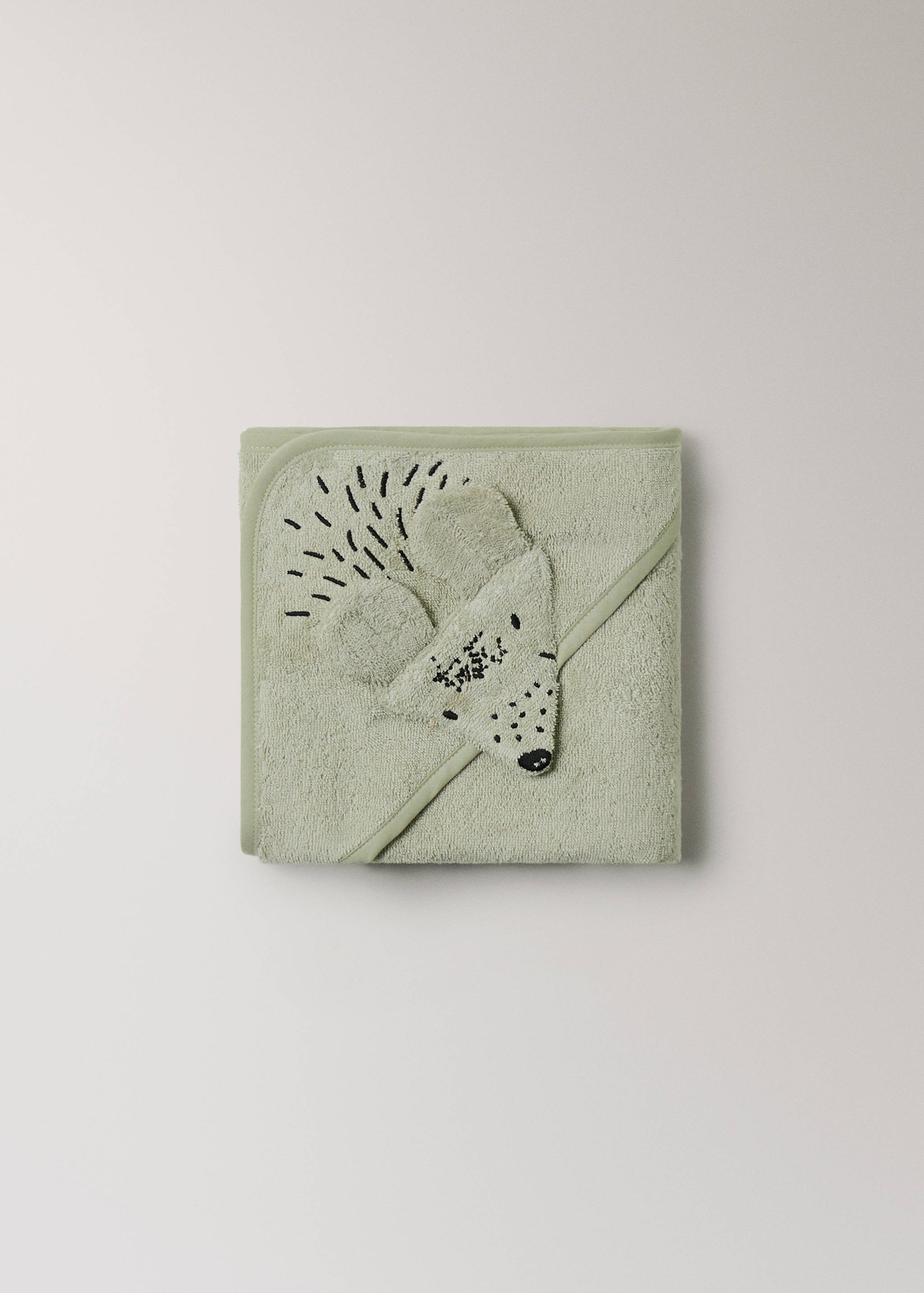 Pale green hooded towel with embroidered animal detail.