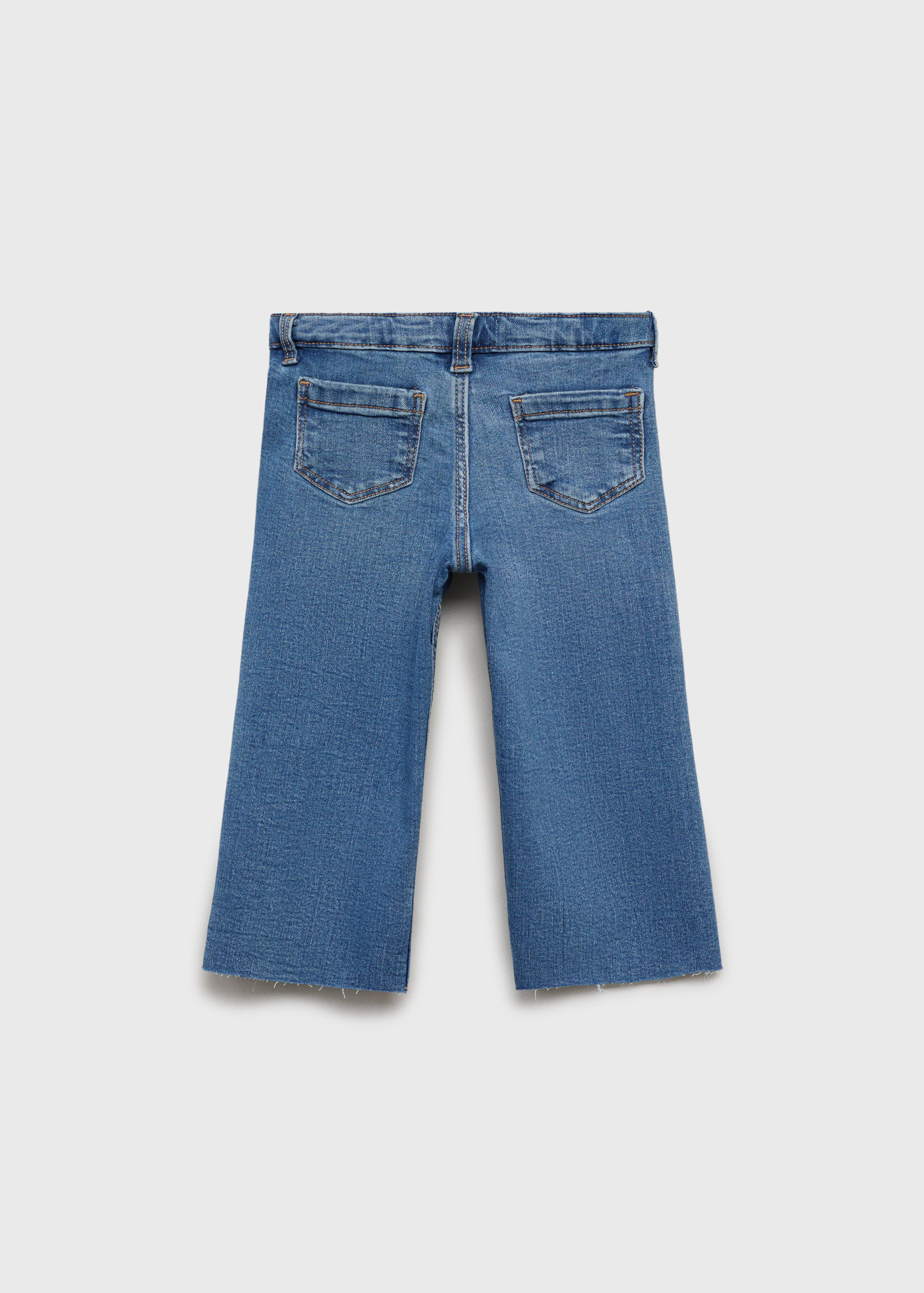 Seamless jeans with frayed hem - Reverse of the article