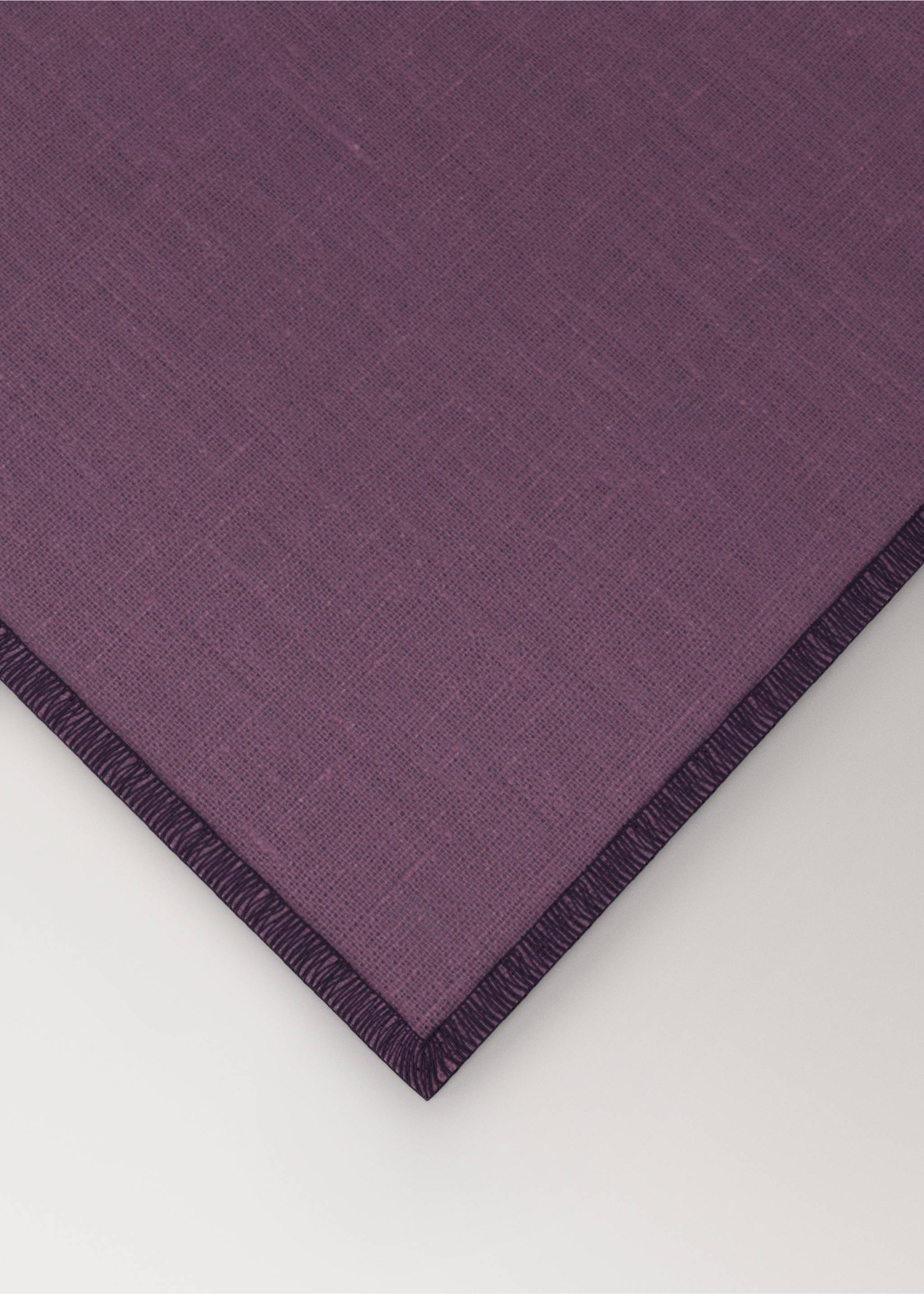 Dark purple textured fabric placemat with a stitched trim detail., Blackberry. Ref: 17024133-00.
