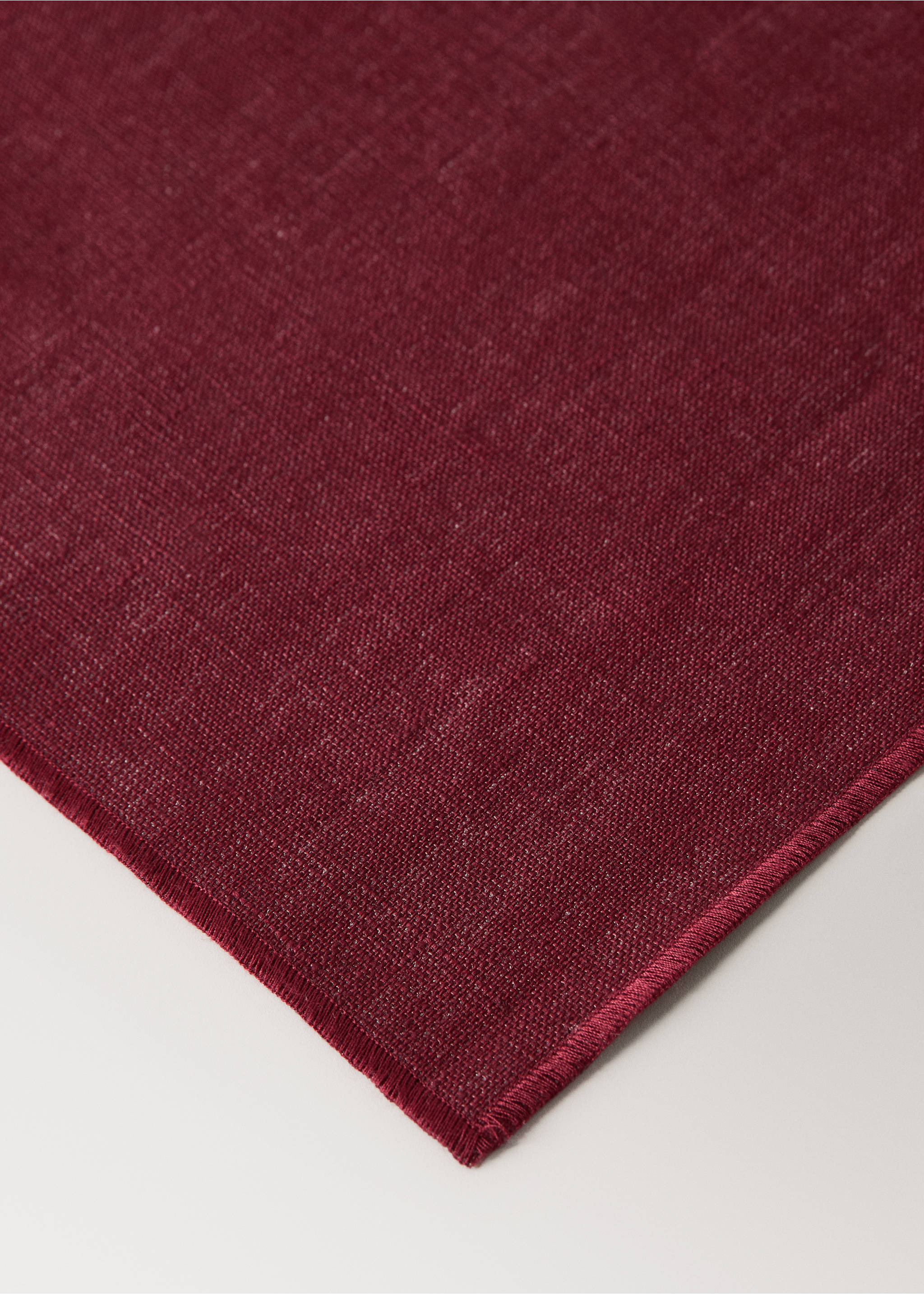 Dark red placemat with a textured weave and stitched border., Red. Ref: 17024133-00.