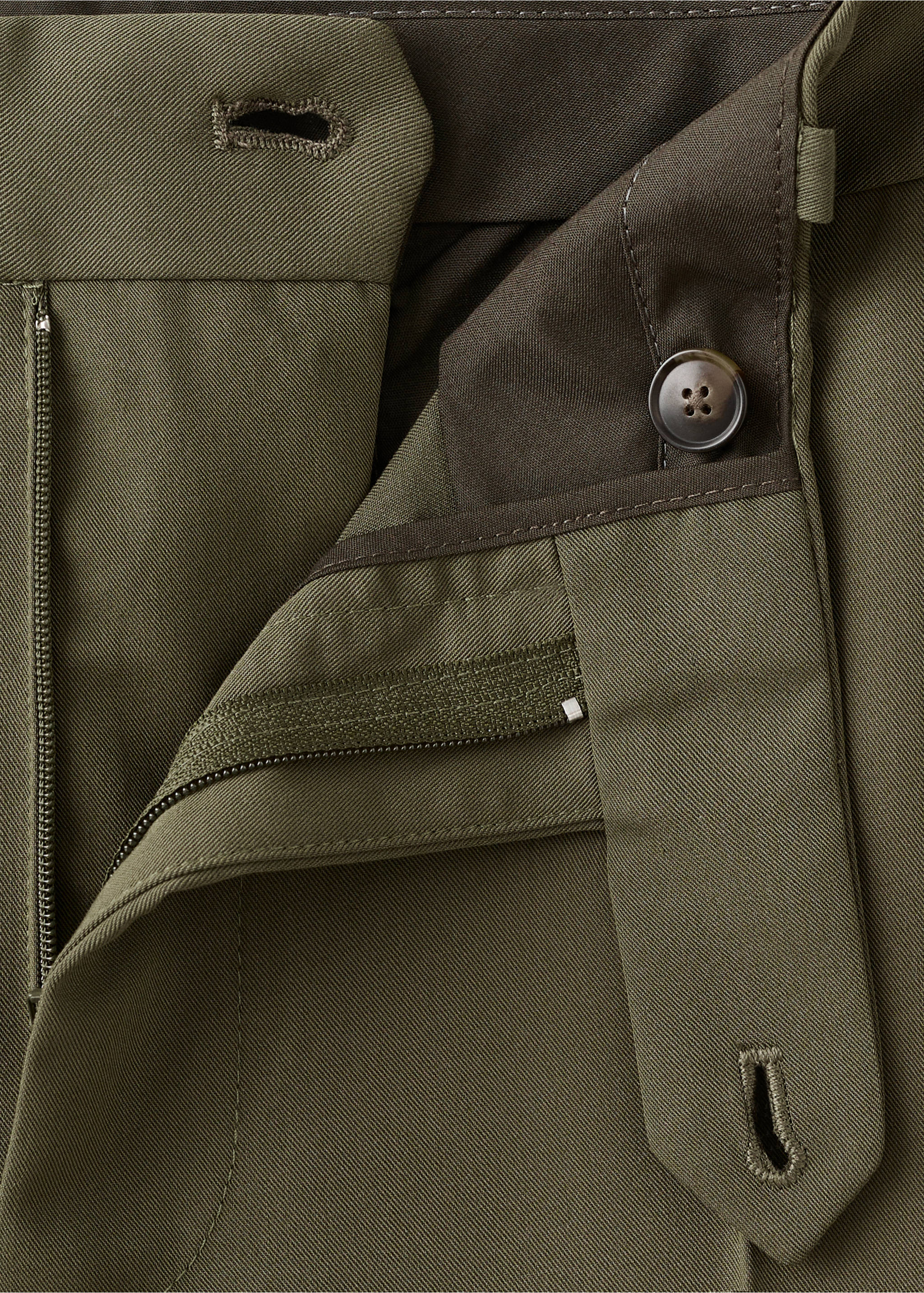Close-up of olive green trousers featuring a tailored waistband and button closure., Khaki. Ref: 17025147-00.