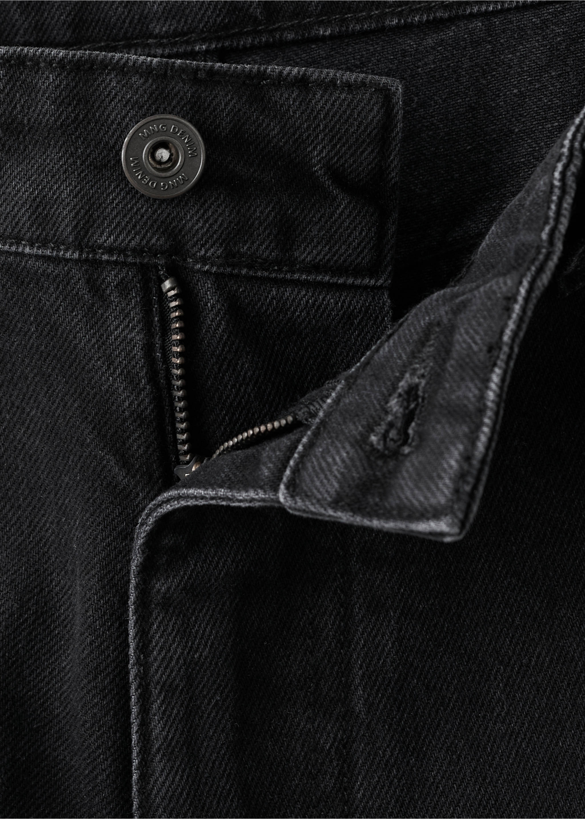 Close-up of black denim trousers waistband and zip fly., Black denim. Ref: 17025174-00.
