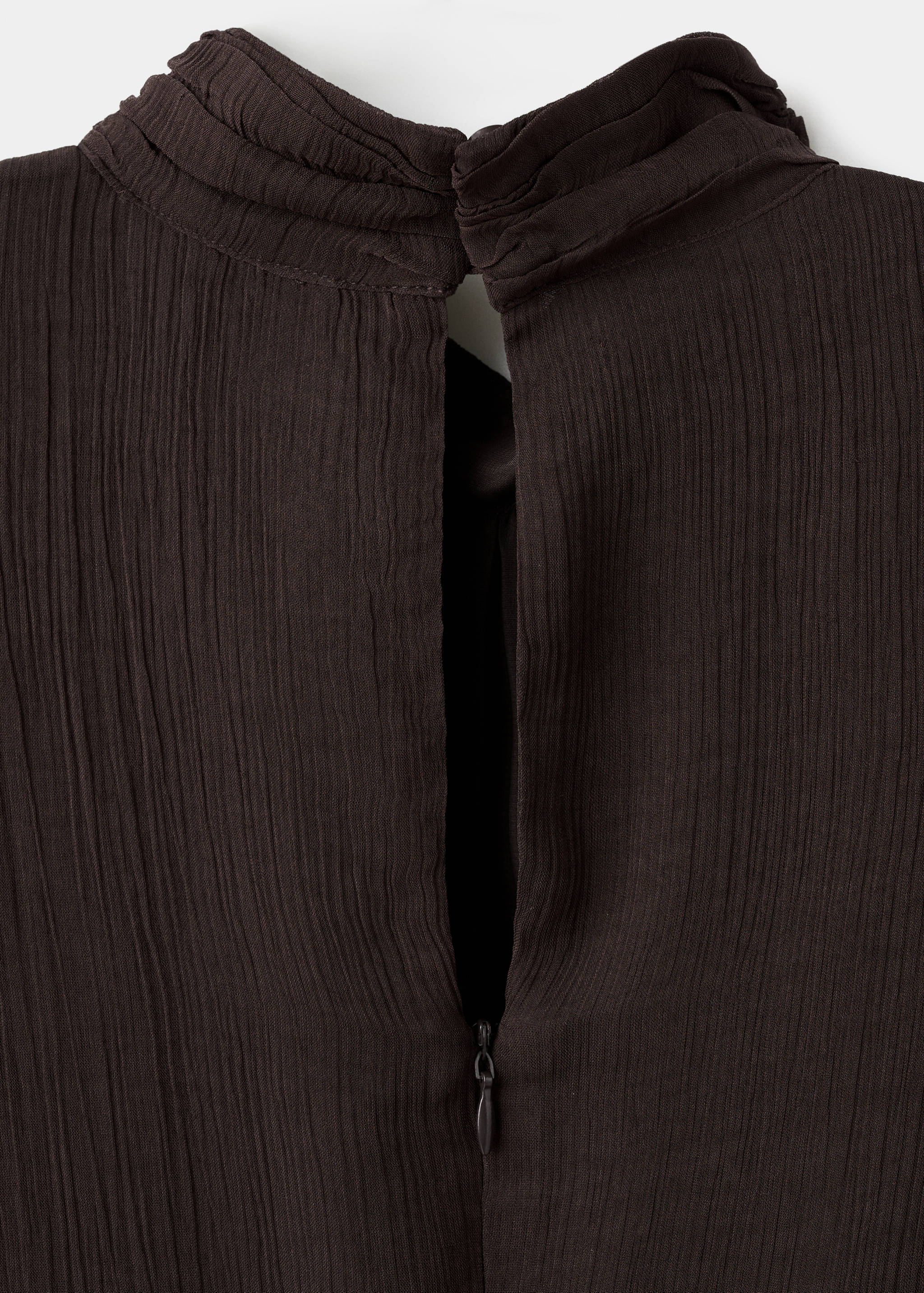 Dark brown dress detail showcasing a gathered high collar and back zip.