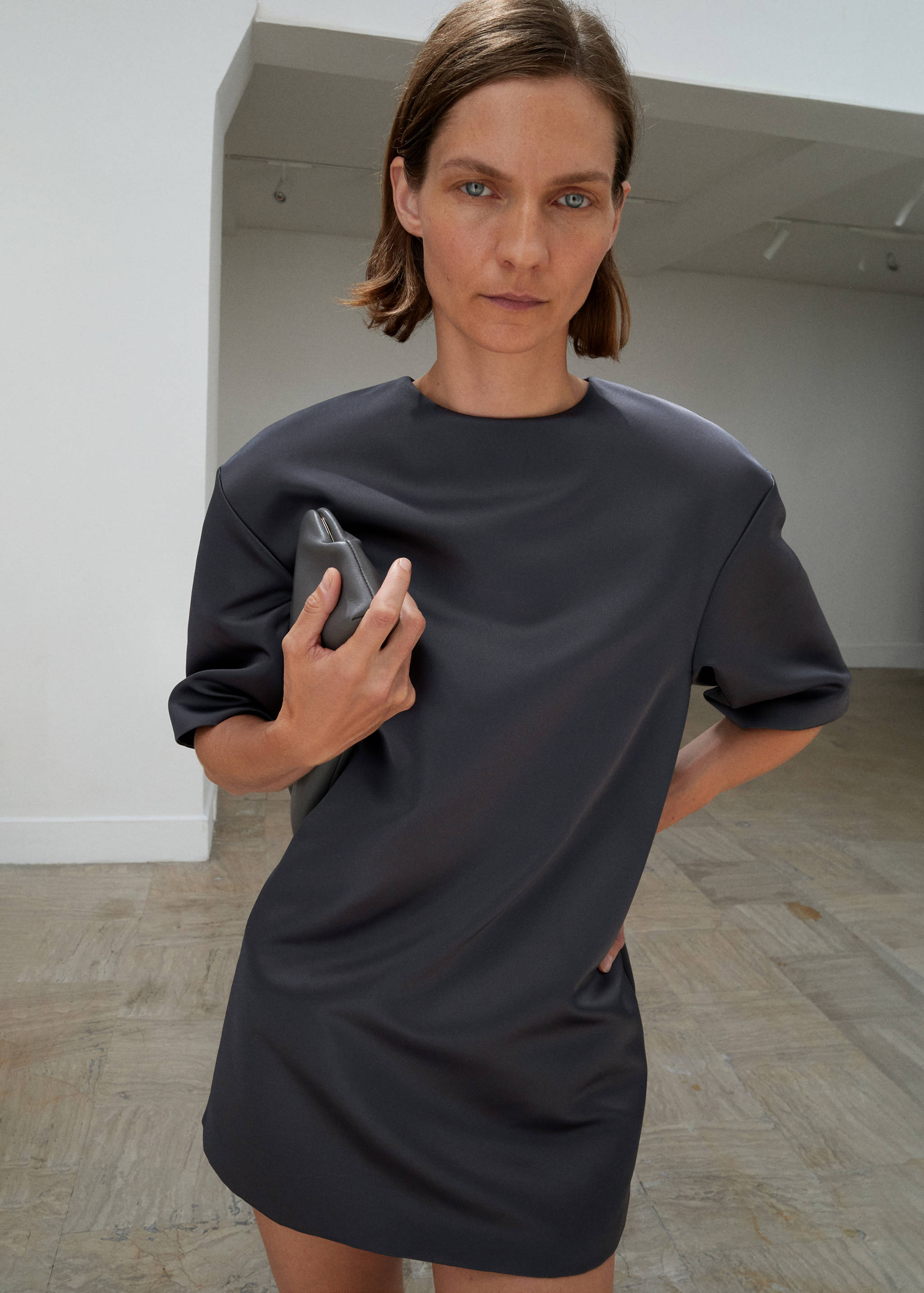 Dark grey short-sleeved round-neck mini dress with a structured fit.