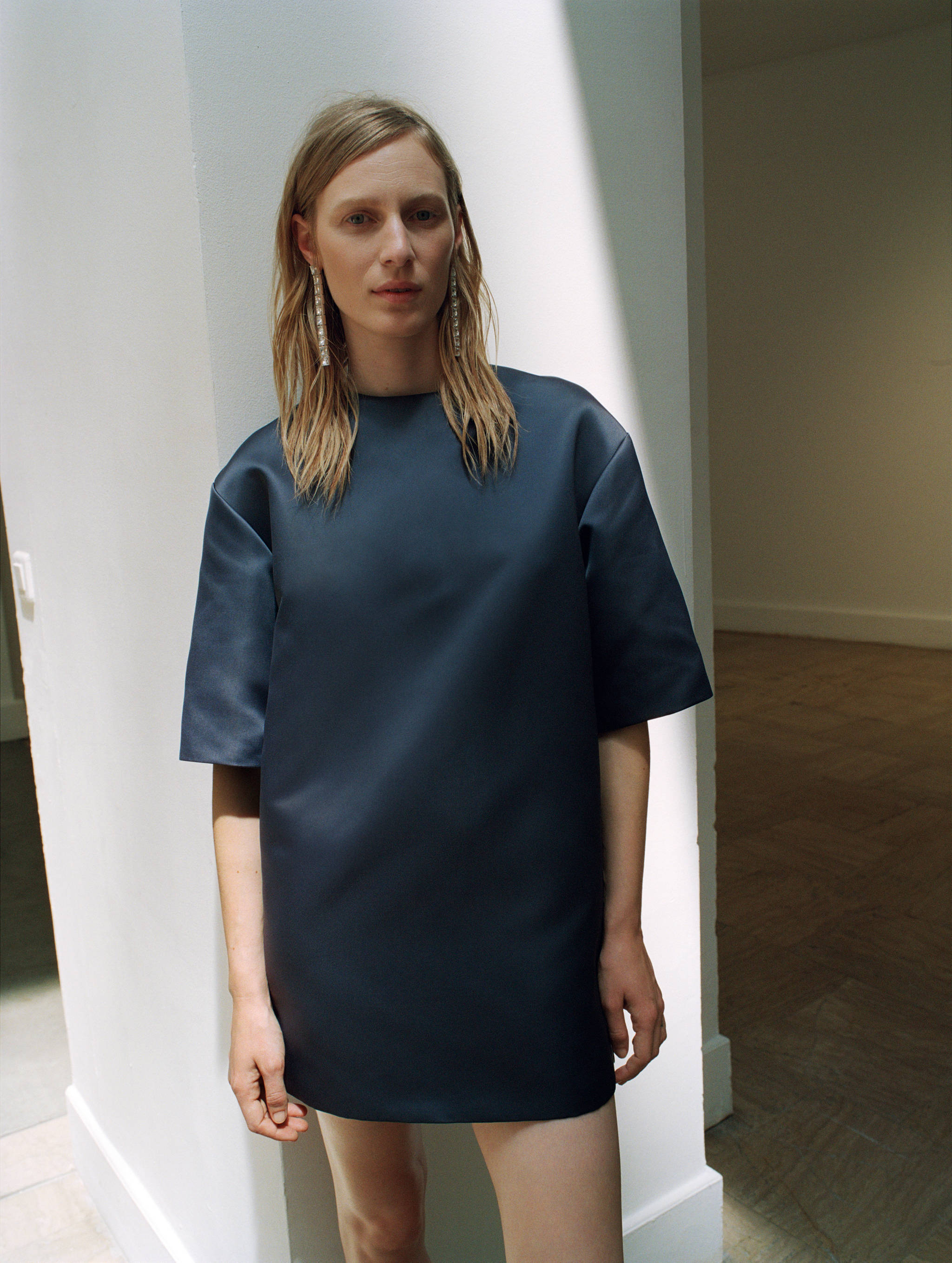 Dark navy blue short-sleeved mini dress with a structured shift silhouette.