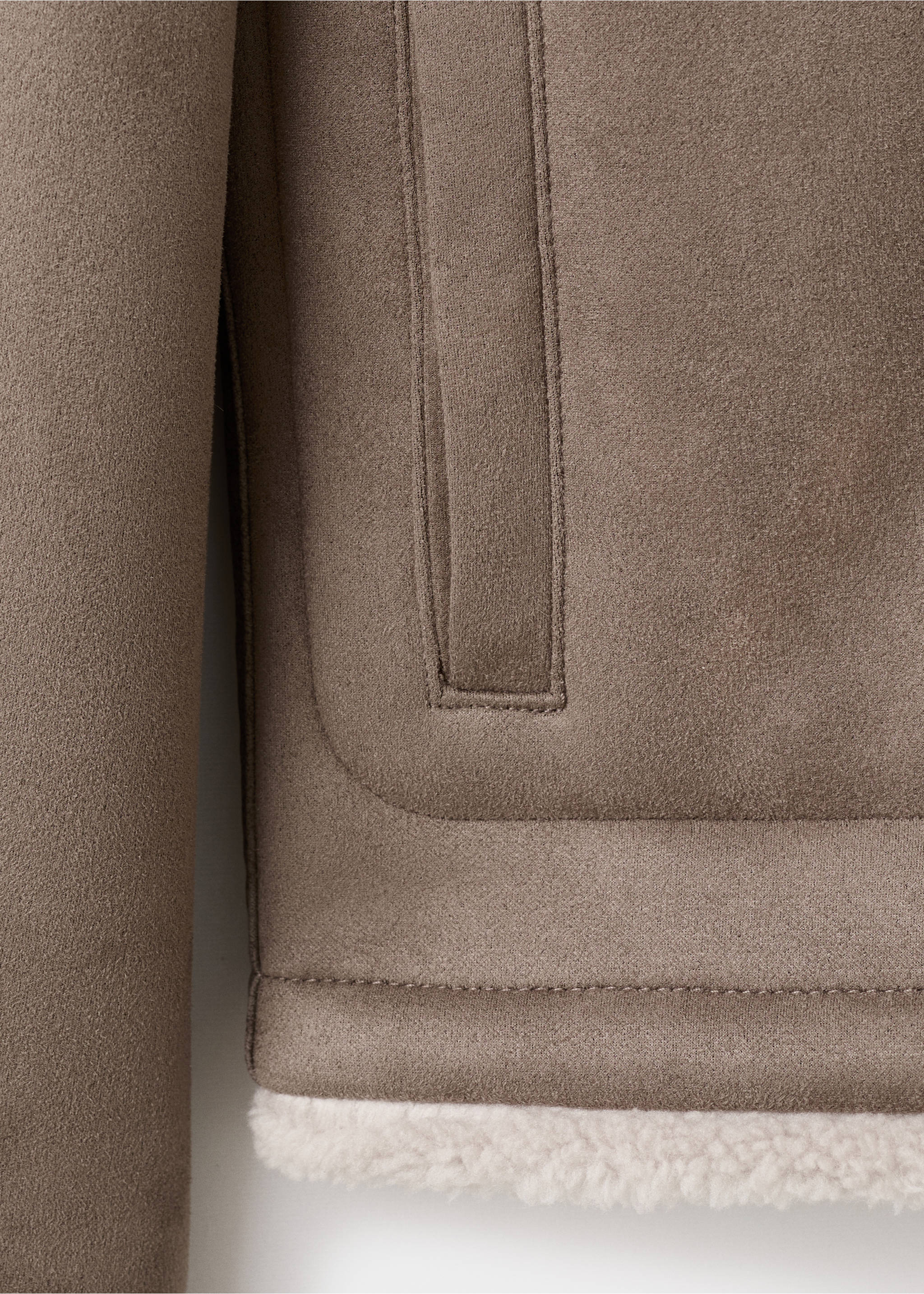 Taupe jacket detail showcasing the welt pocket and faux-shearling hem., Medium Brown. Ref: 17027889-00.