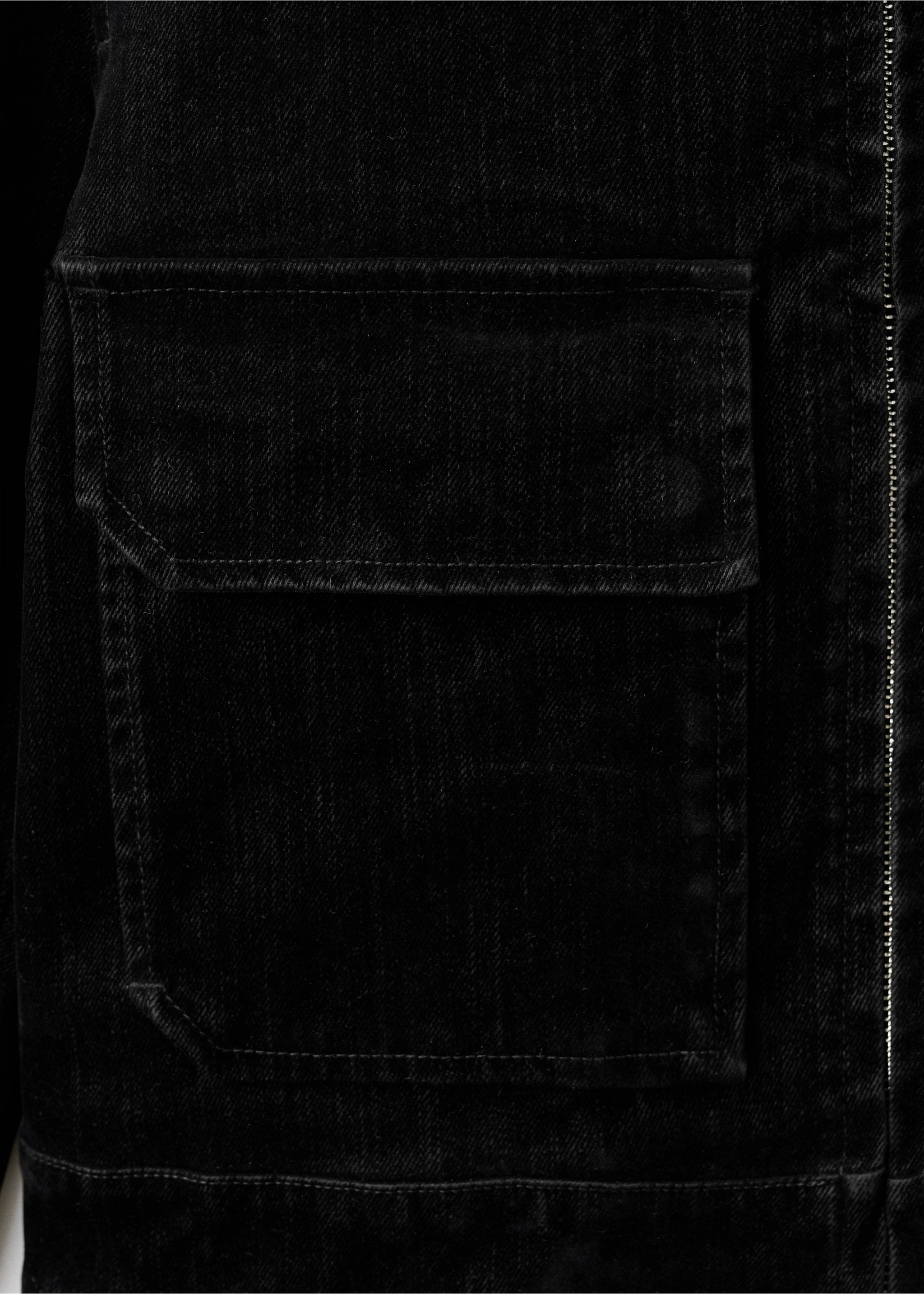 Close-up of a black denim jacket pocket and zip detail., Black. Ref: 17029099-00.