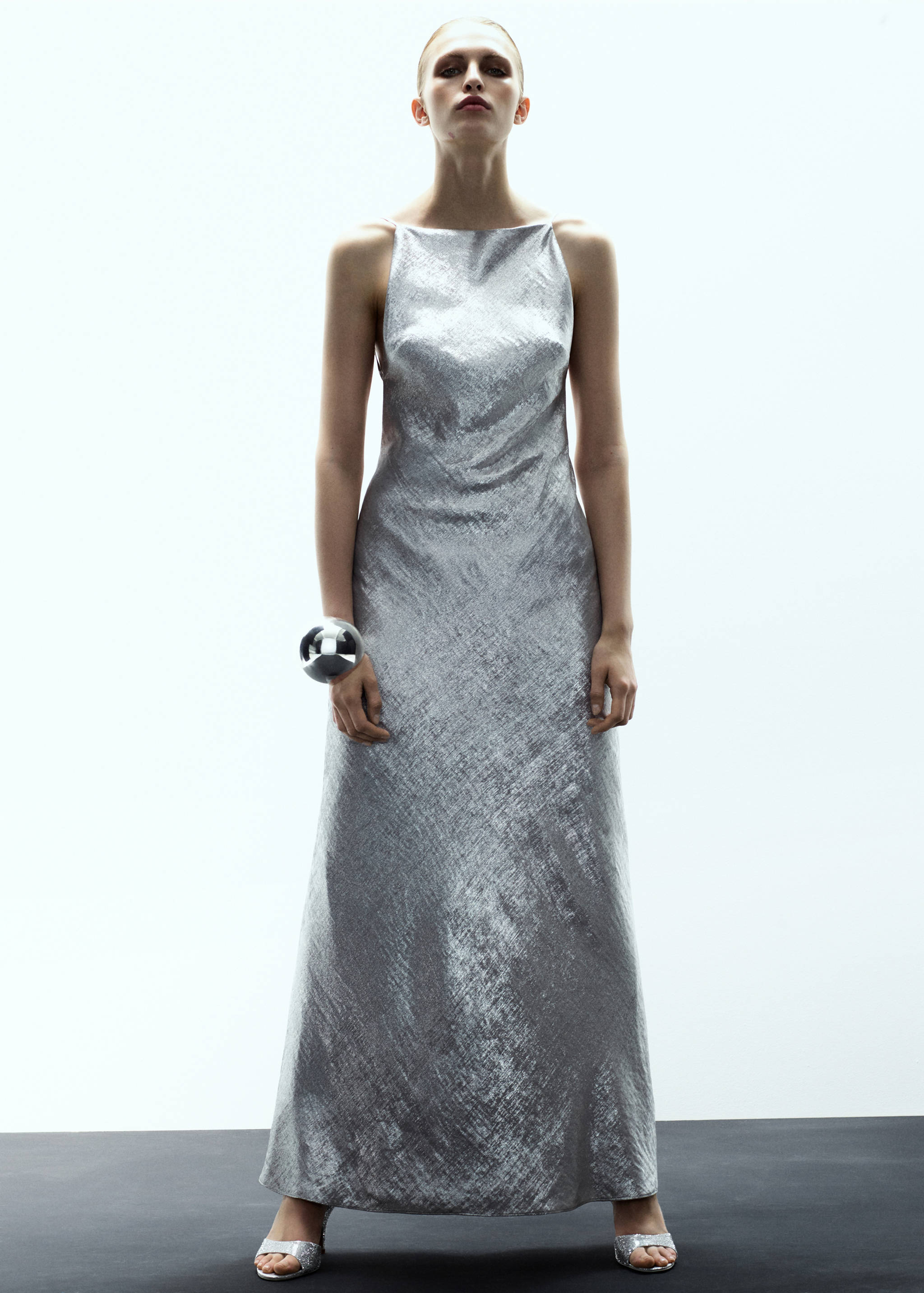 Sleeveless metallic silver maxi dress with a square neckline.