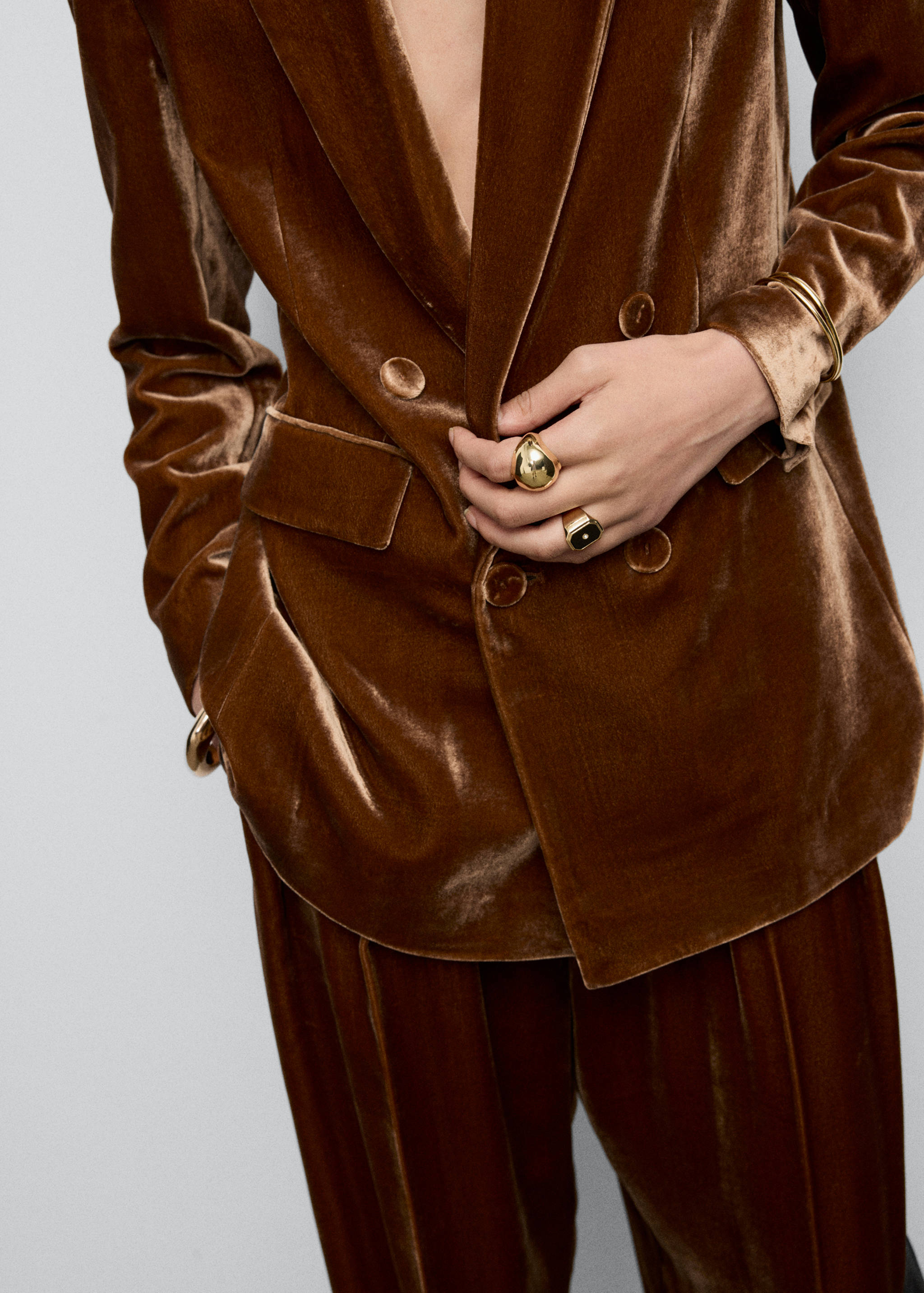 Brown velvet double-breasted blazer with matching trousers.