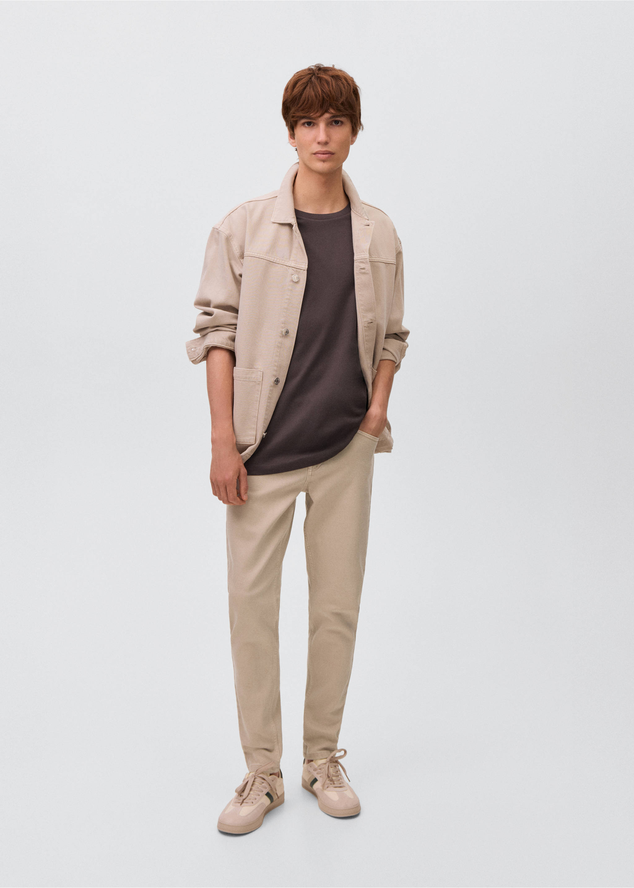 Beige denim overshirt worn with a dark grey t-shirt and matching beige trousers., Beige. Ref: 17031254-00.