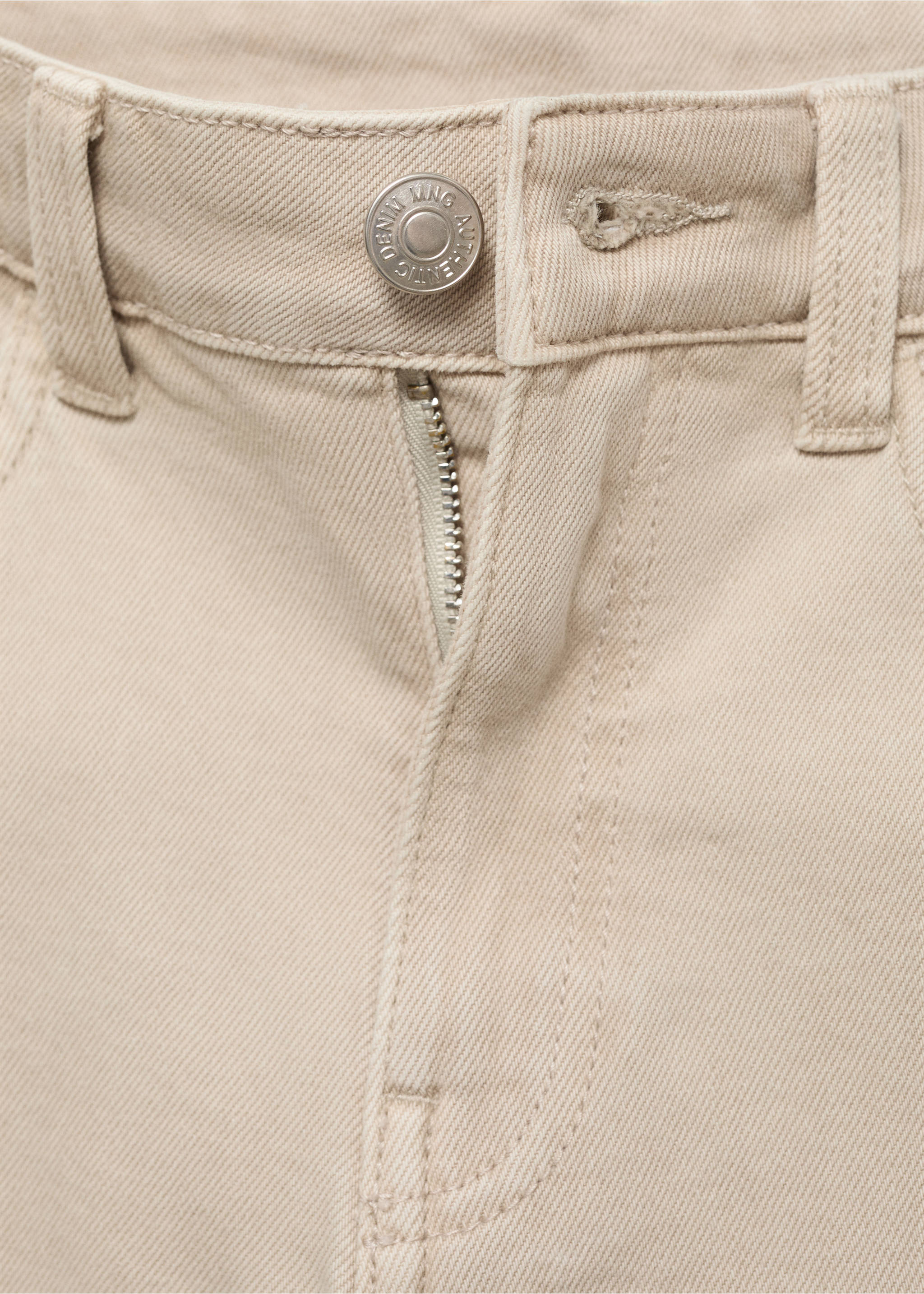 Close-up of beige denim trousers waistband and metal button detail., Beige. Ref: 17031254-00.