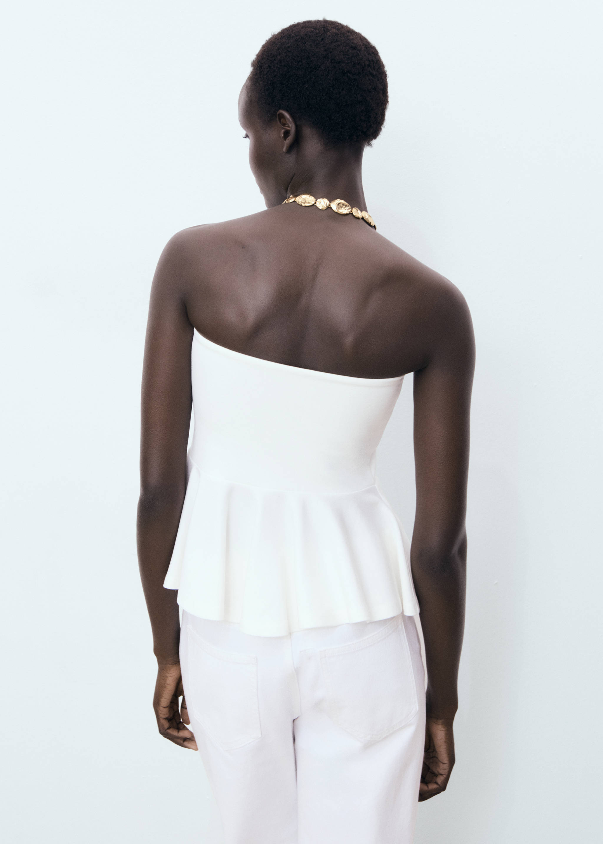 Strapless peplum top - Reverse of the article