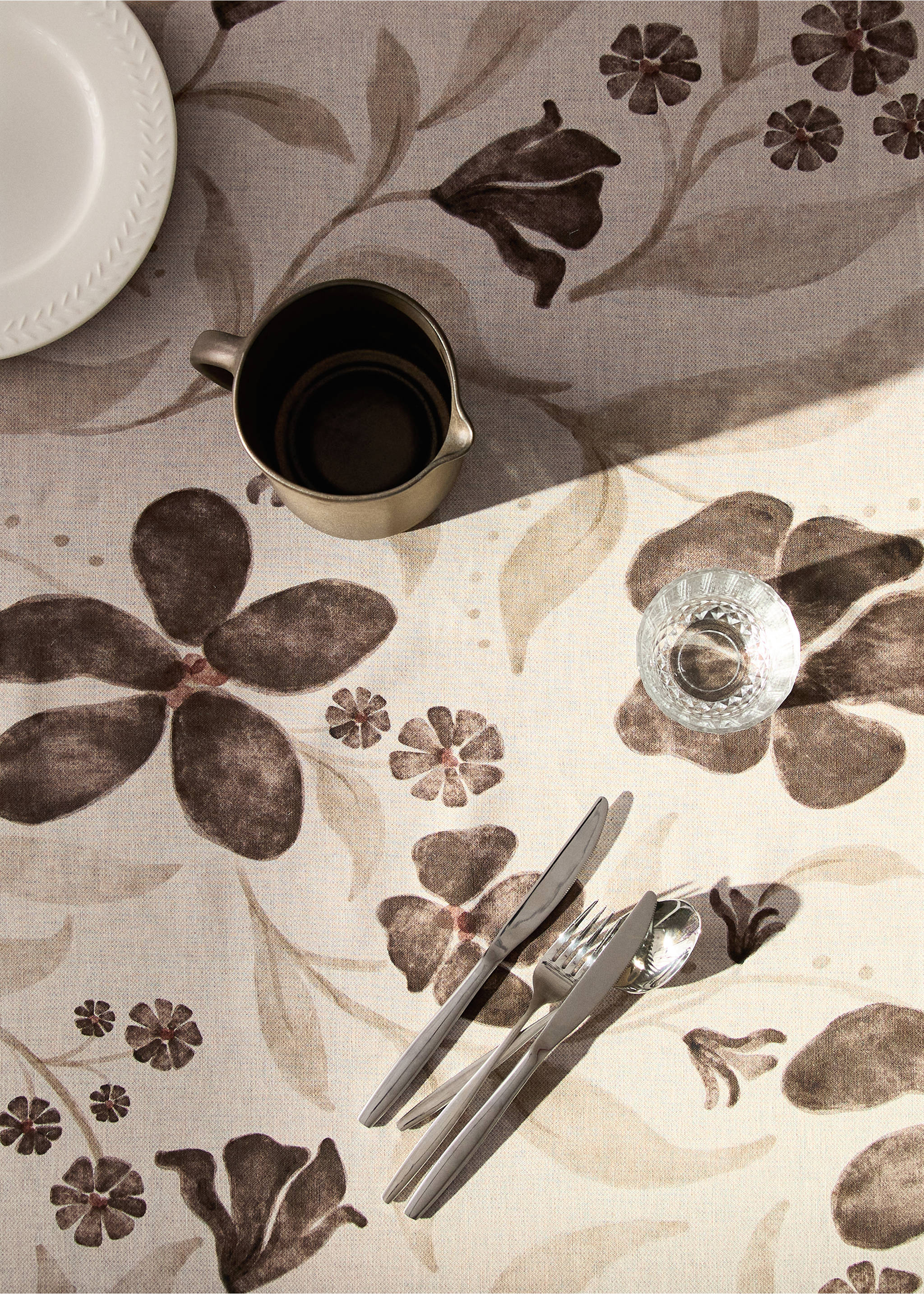 Brown and beige floral print tablecloth styled with tableware., Medium Brown. Ref: 17034134-00.